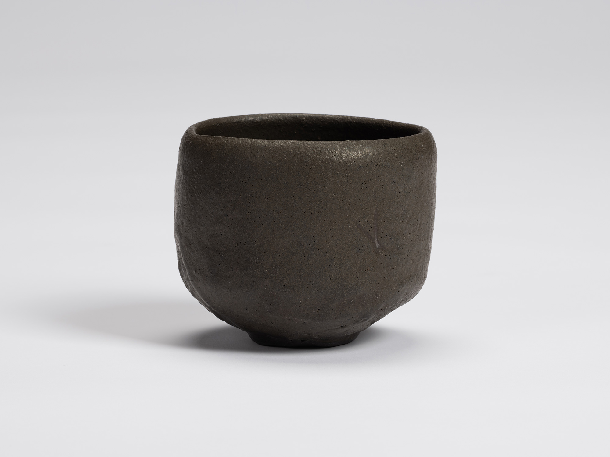 Front view of Chawan No. 9 by Shiro Tsujimura. The hand-formed tea bowl has a gently rounded cylindrical...
