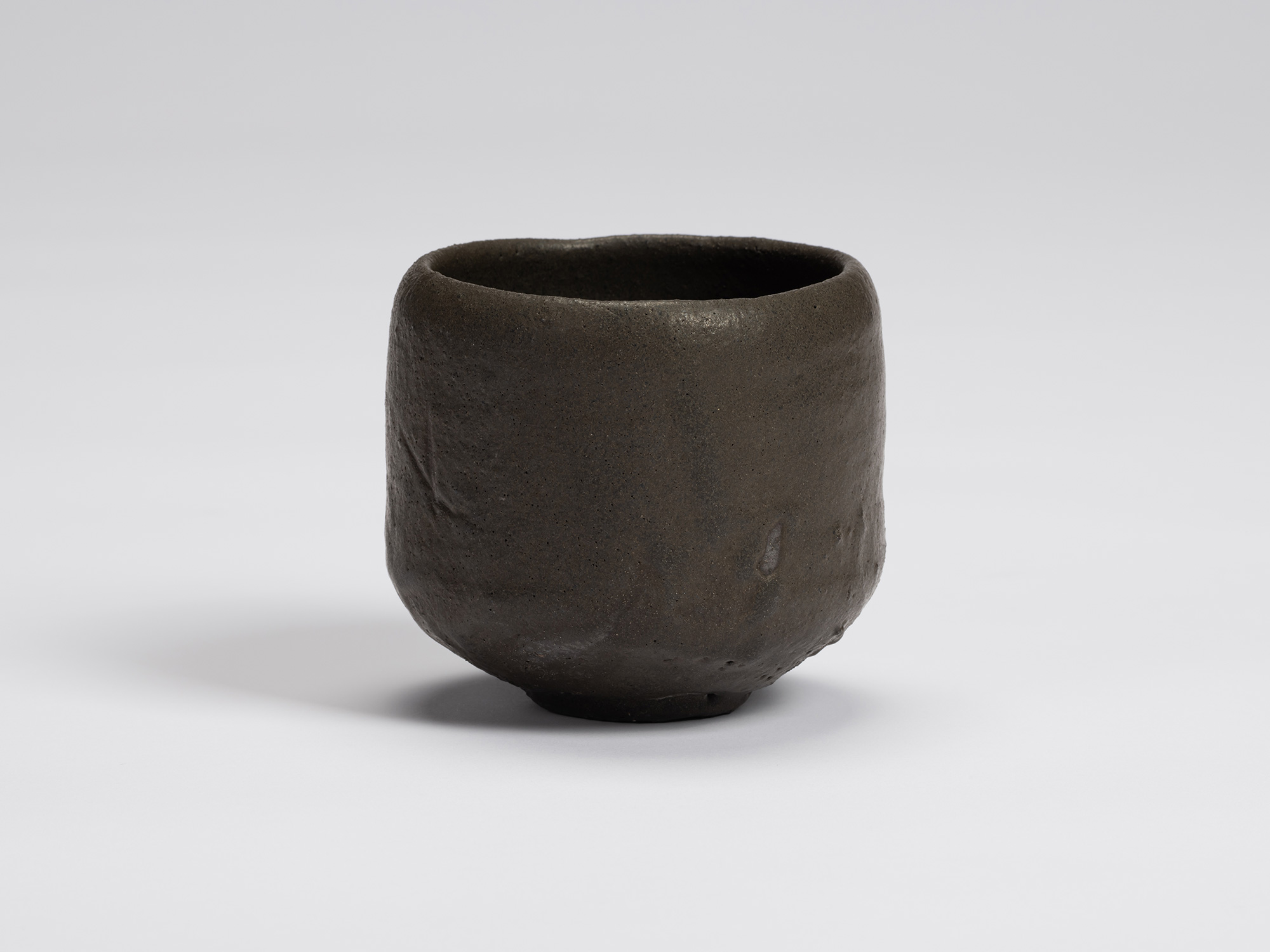 Front view of Chawan No. 9 by Shiro Tsujimura. The hand-formed tea bowl has a gently rounded cylindrical...