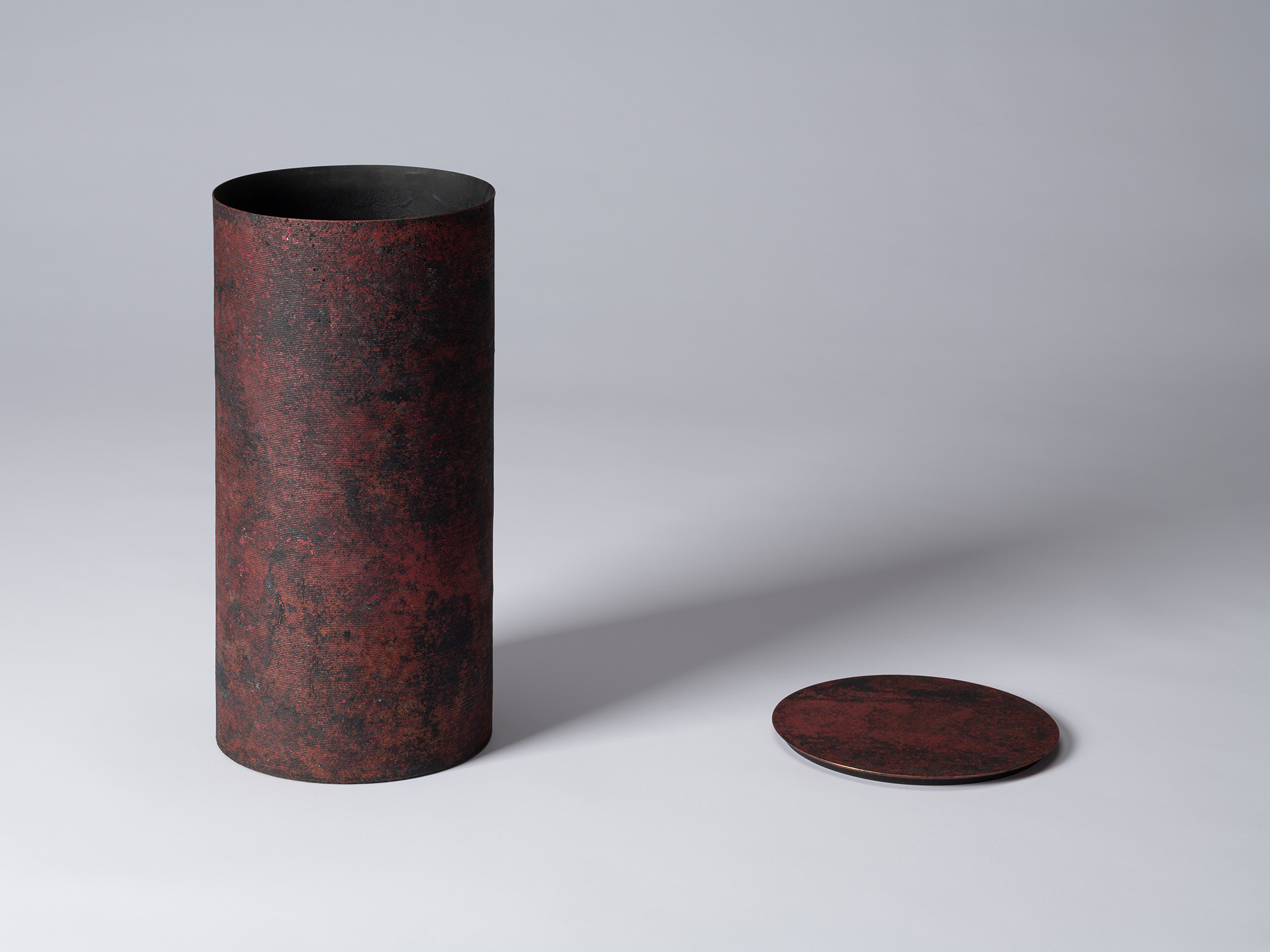 Hatakeyama's Cylinder with Lid - Red. Lid is removed and placed to the right of the cylinder. Open...