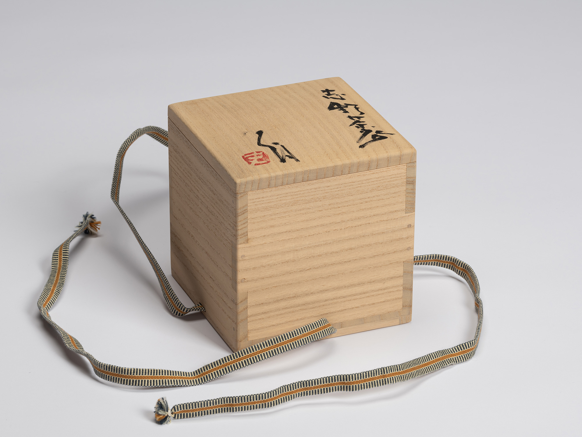 Closed tomobako (signed wooden presentation box) for Shino Chawan by Shiro Tsujimura. The paulownia...