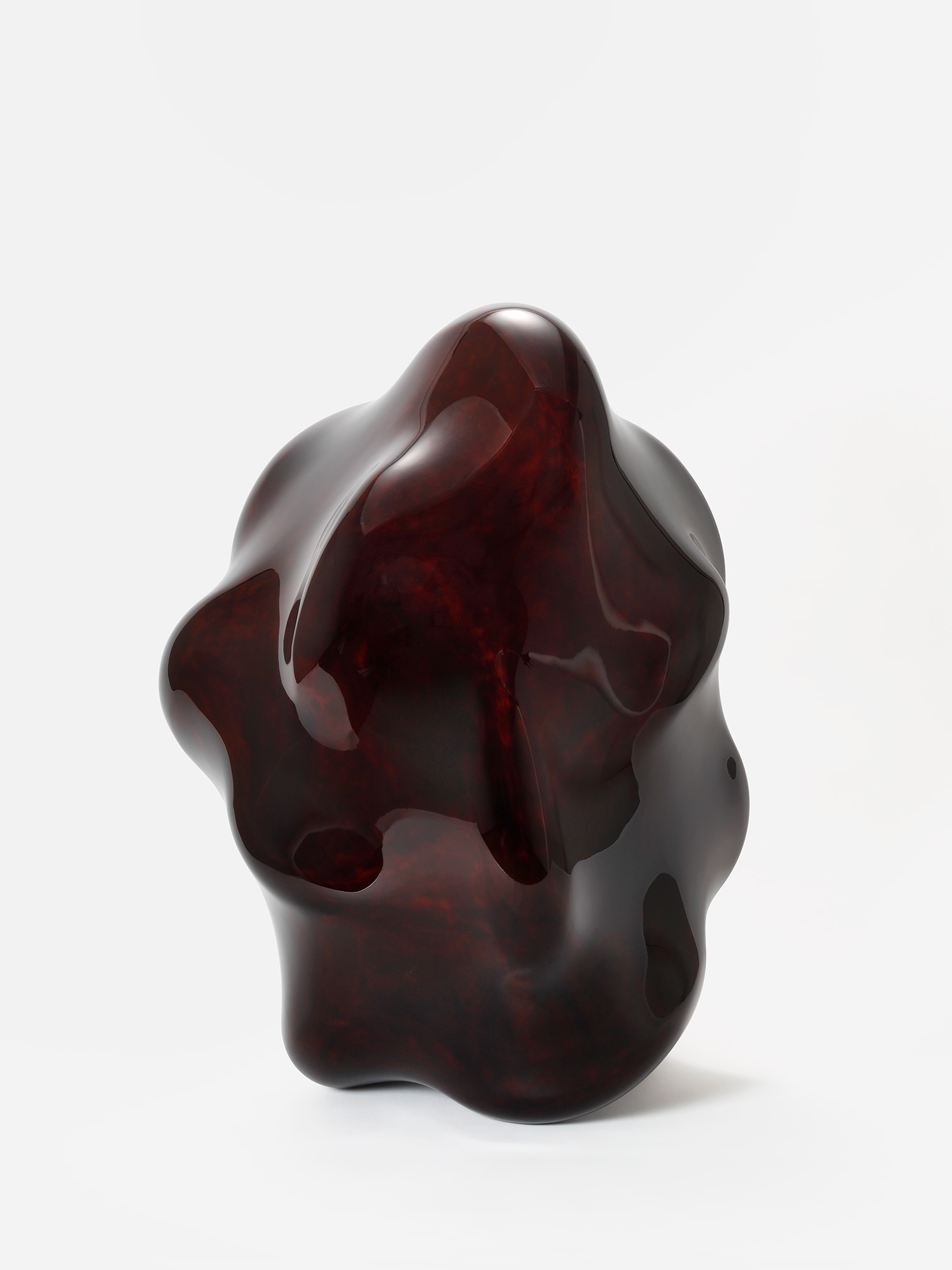 View of Taxis Groove – Wavy Line by Genta Ishizuka, an organic dark lacquer sculpture with a highly...
