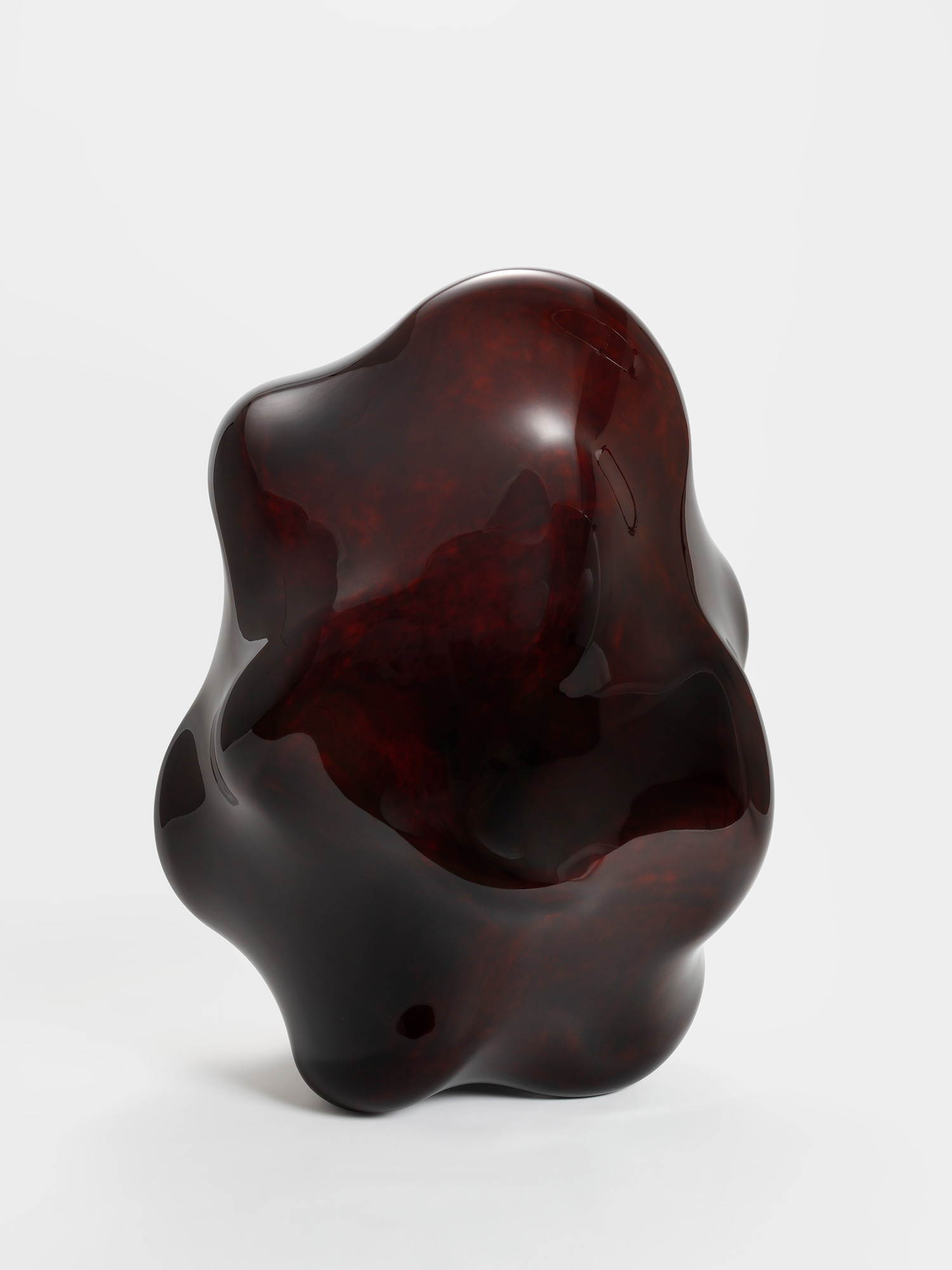 View of Taxis Groove – Wavy Line by Genta Ishizuka, an organic dark lacquer sculpture with a highly...