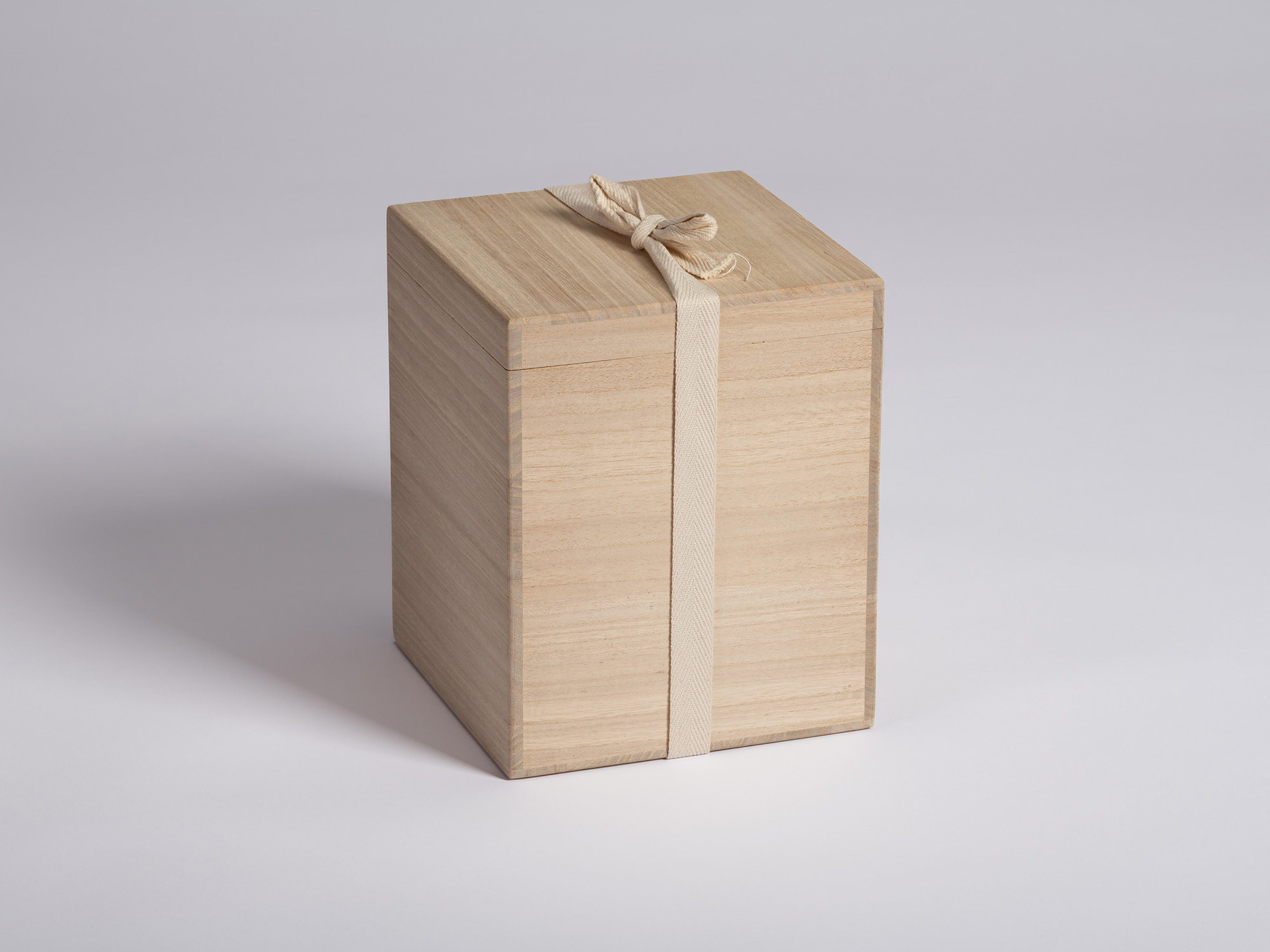Closed paulownia wood presentation box (tomobako) for Untitled by Genta Ishizuka. The rectangular...