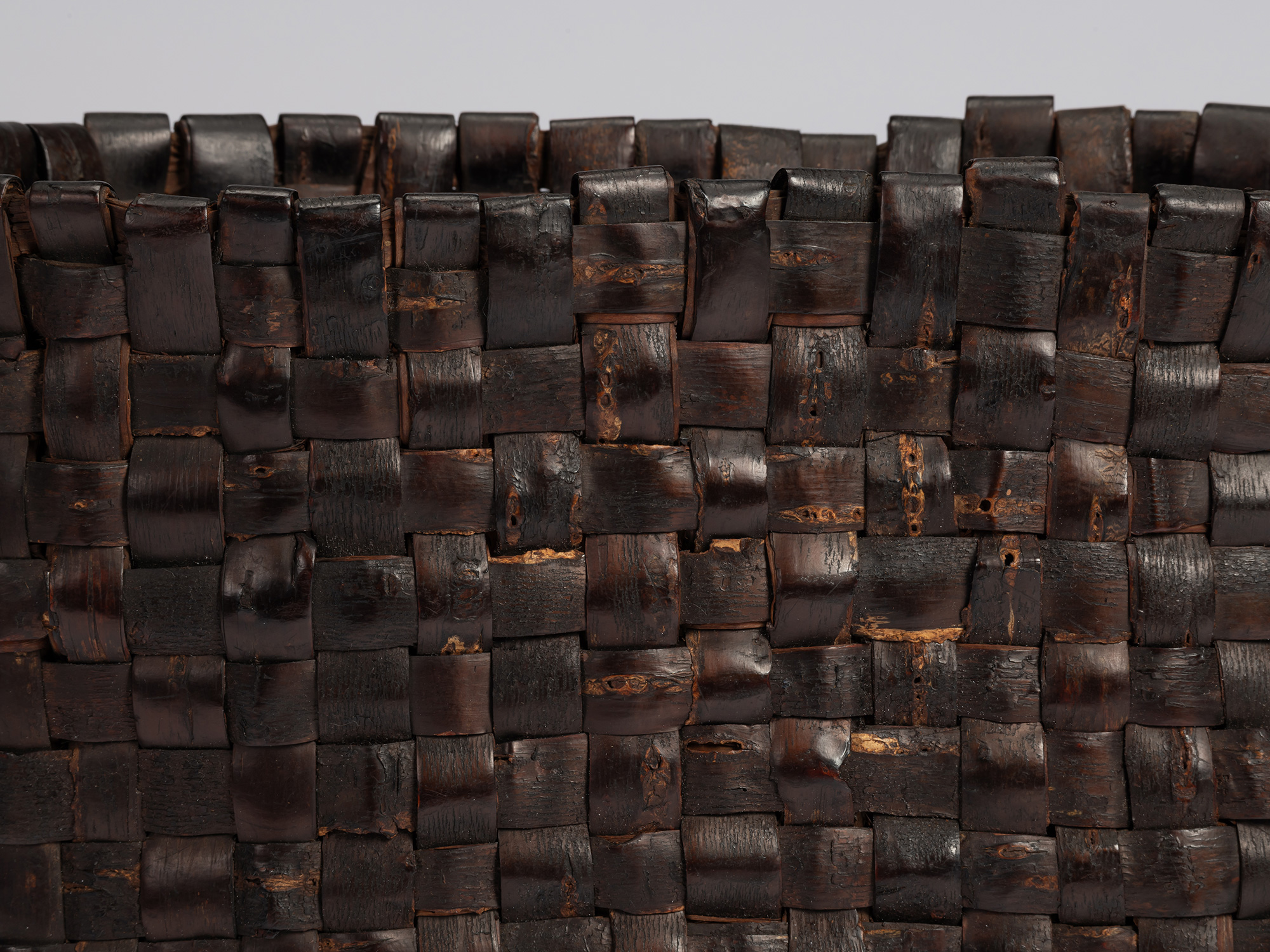 Detail of the upper edge of the kabakago basket, showing overlapping woven strips of wild cherry...