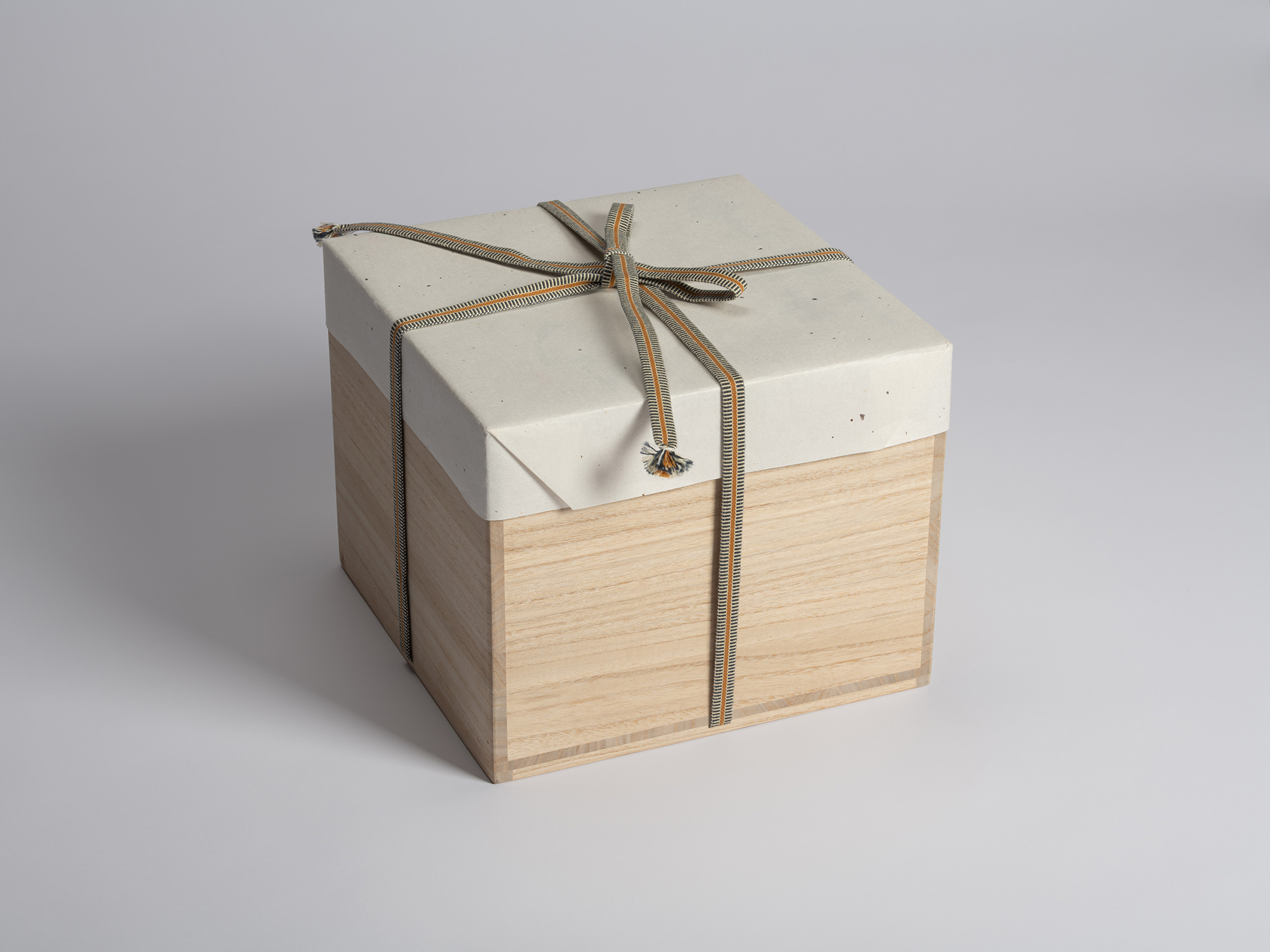 Large wooden tomobako designed to house multiple Kuro Tokkuri by Shiro Tsujimura, covered with...