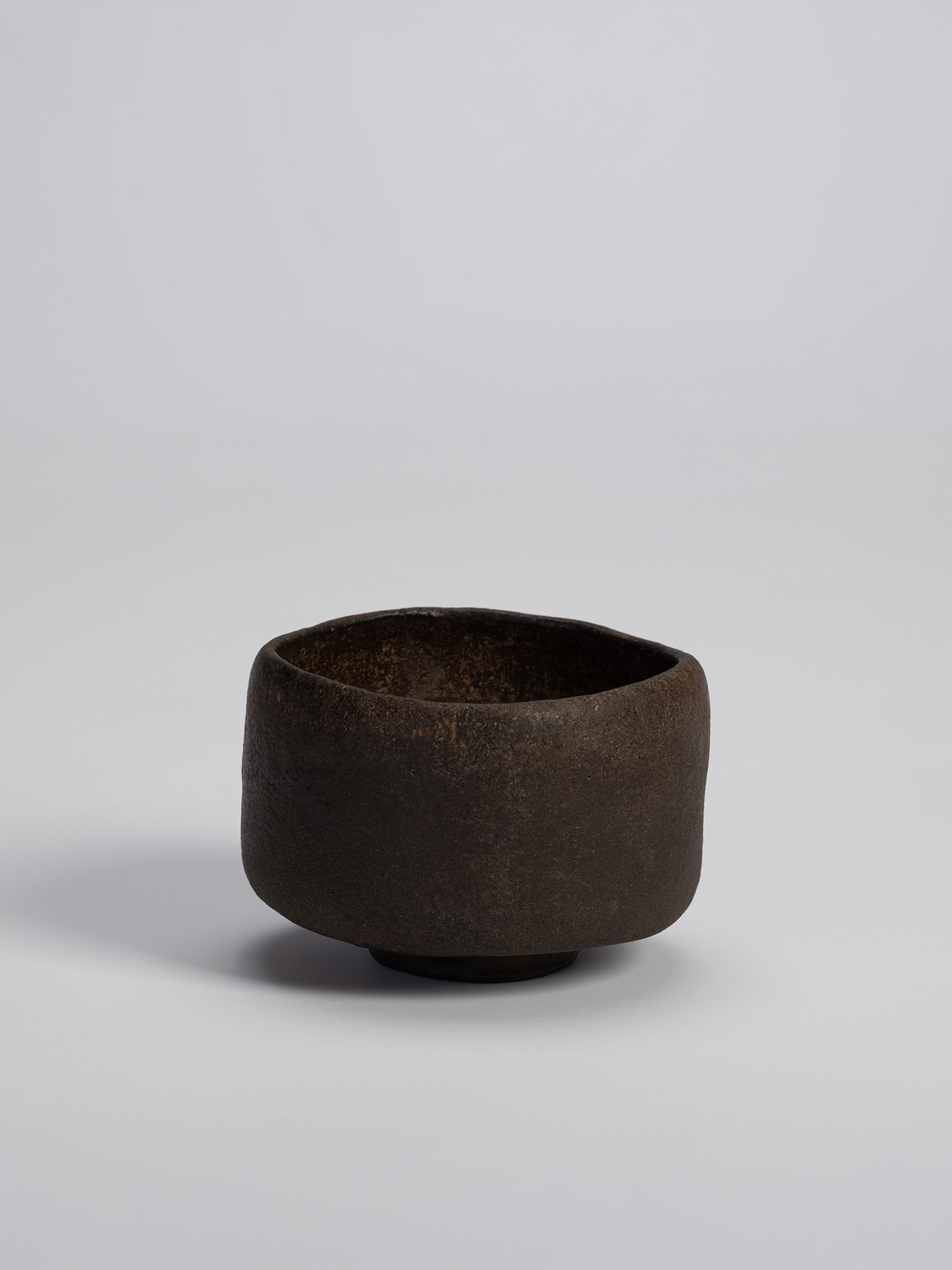 Raku tea bowl entitled Musashino by Chōjirō, a hand-formed black chawan with thick rounded walls...