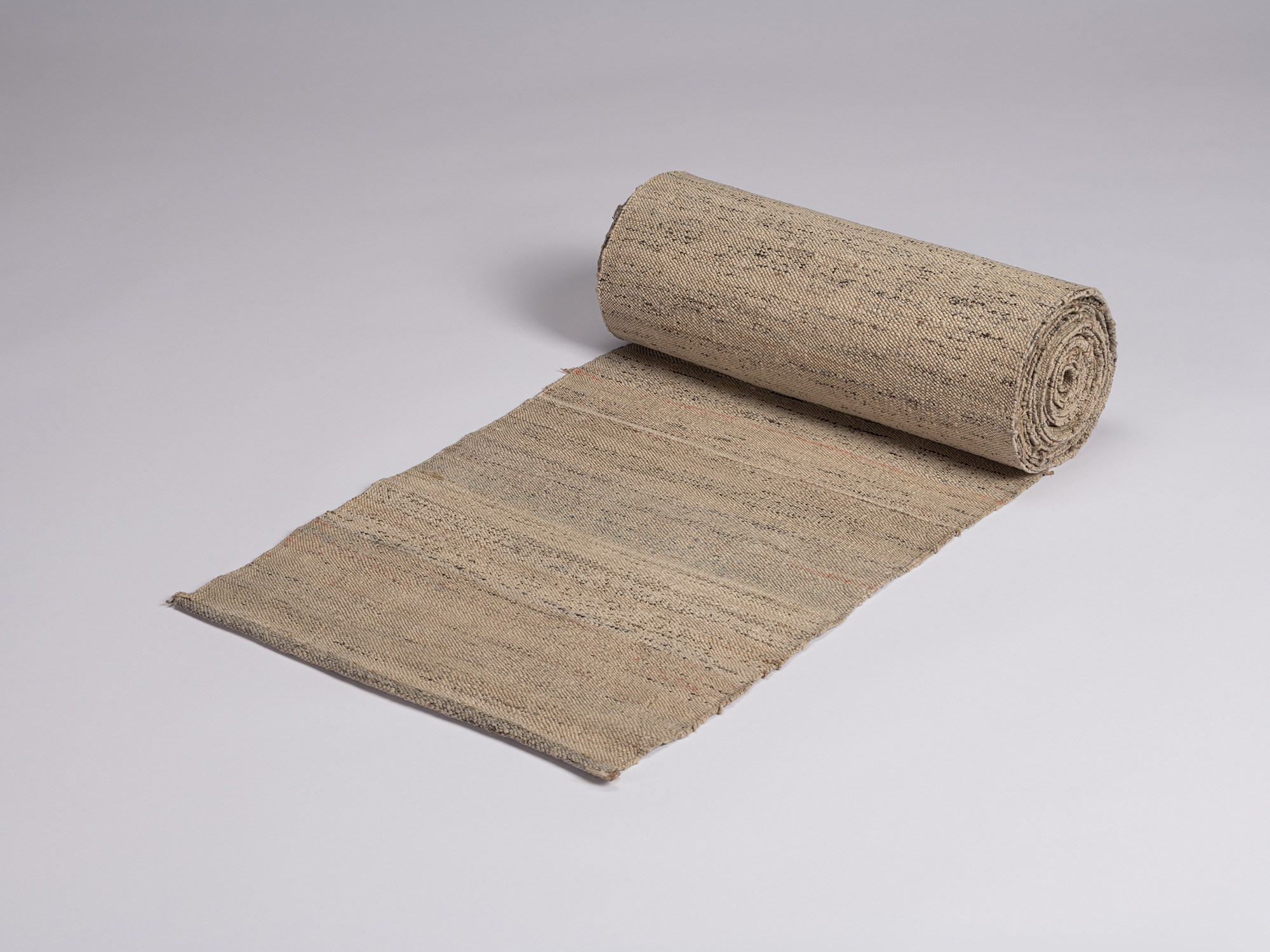 Bolt of otsuzure fabric, approximately 6½ yards long and 13 inches wide, partially unrolled to...