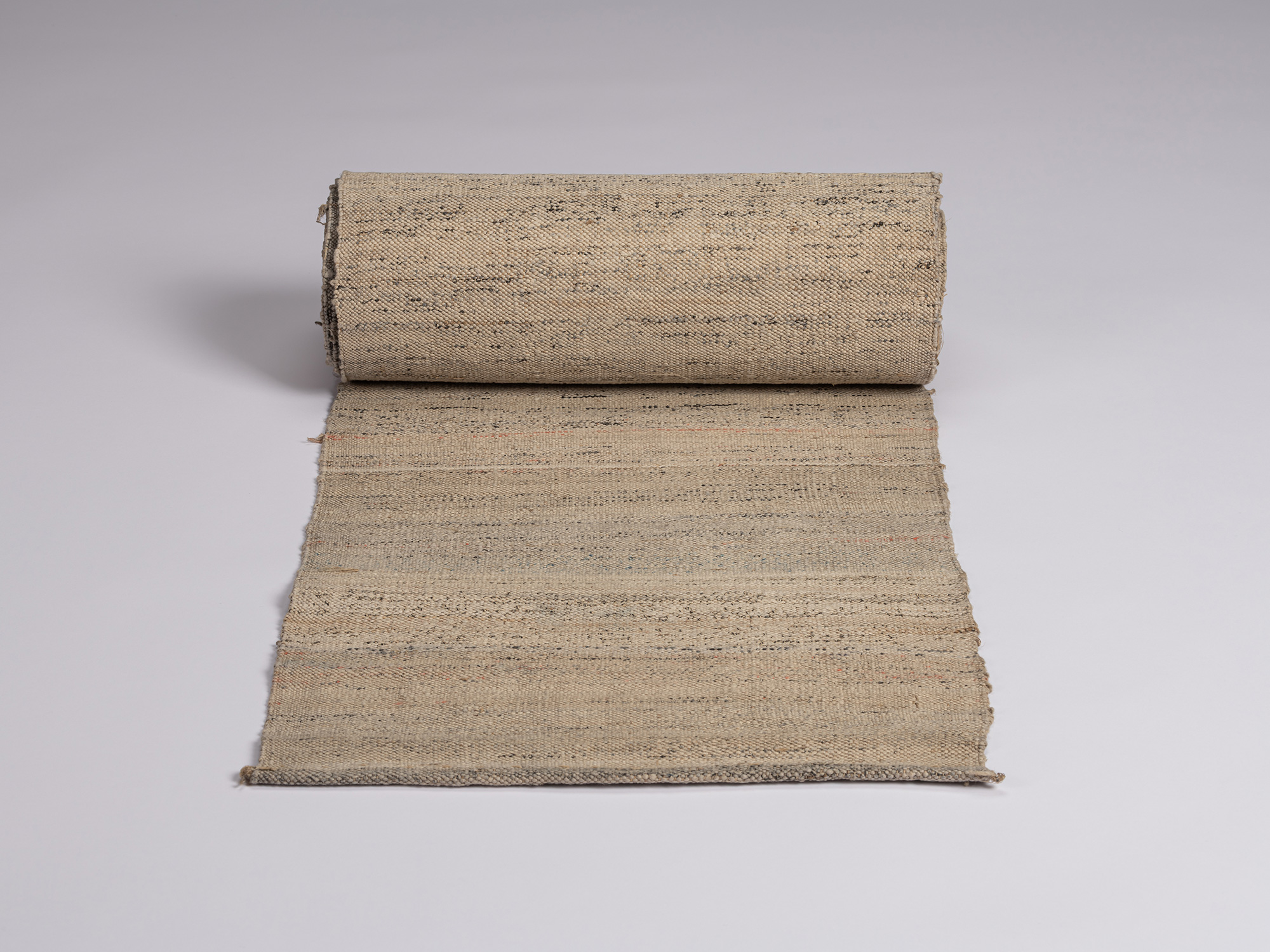 Front view of partially unrolled otsuzure fabric, approximately 6½ yards long and 13 inches wide,...