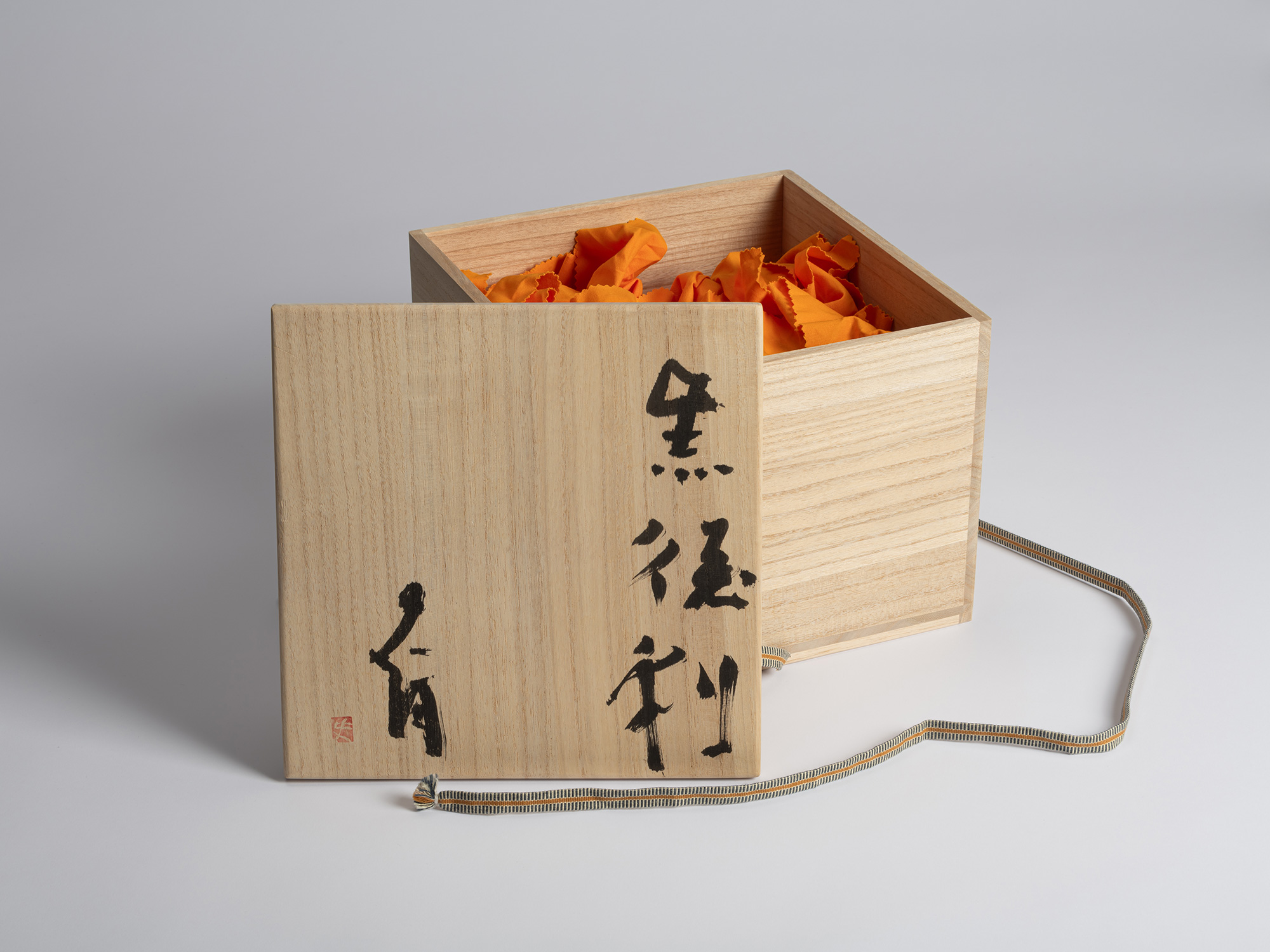 Open wooden tomobako designed to house multiple Kuro Tokkuri by Shiro Tsujimura, with black Japanese...