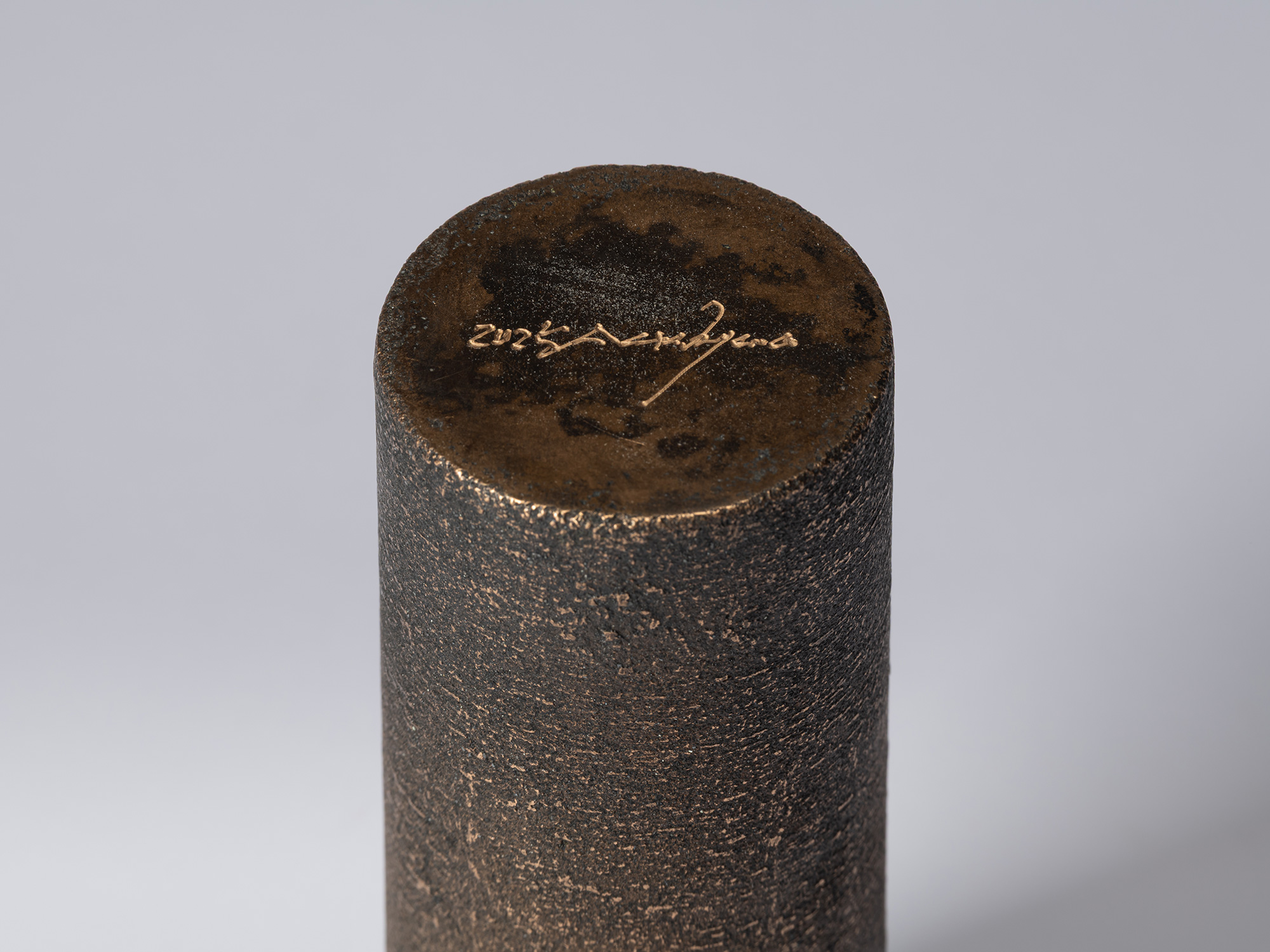 Detail of the base of Koji Hatakeyama’s bronze as Bronze II No. 14, showing the artist’s signature...