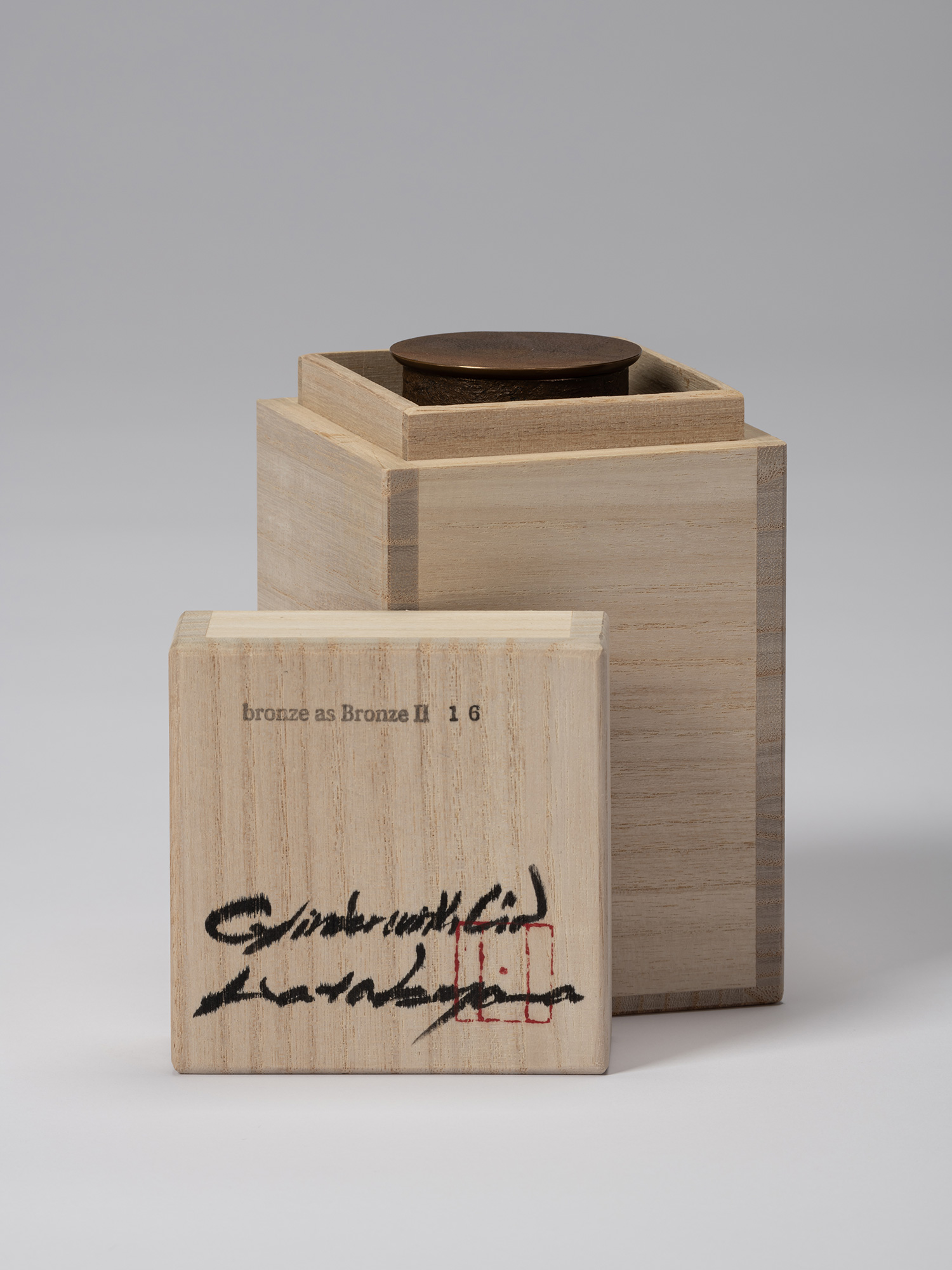 Koji Hatakeyama’s bronze as Bronze II No. 16 partially enclosed in its wooden tomobako, with the...