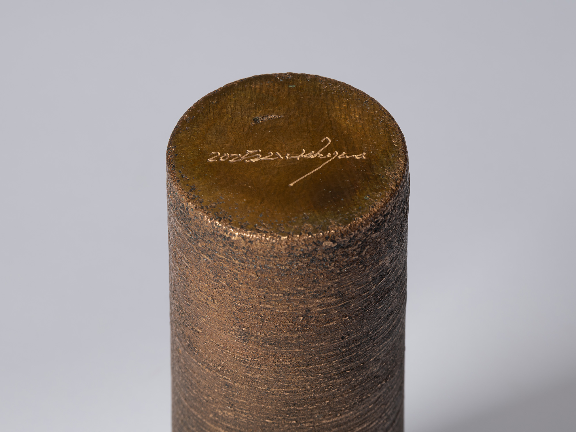 Detail of the base of Koji Hatakeyama’s bronze as Bronze II No. 16, showing the artist’s signature...