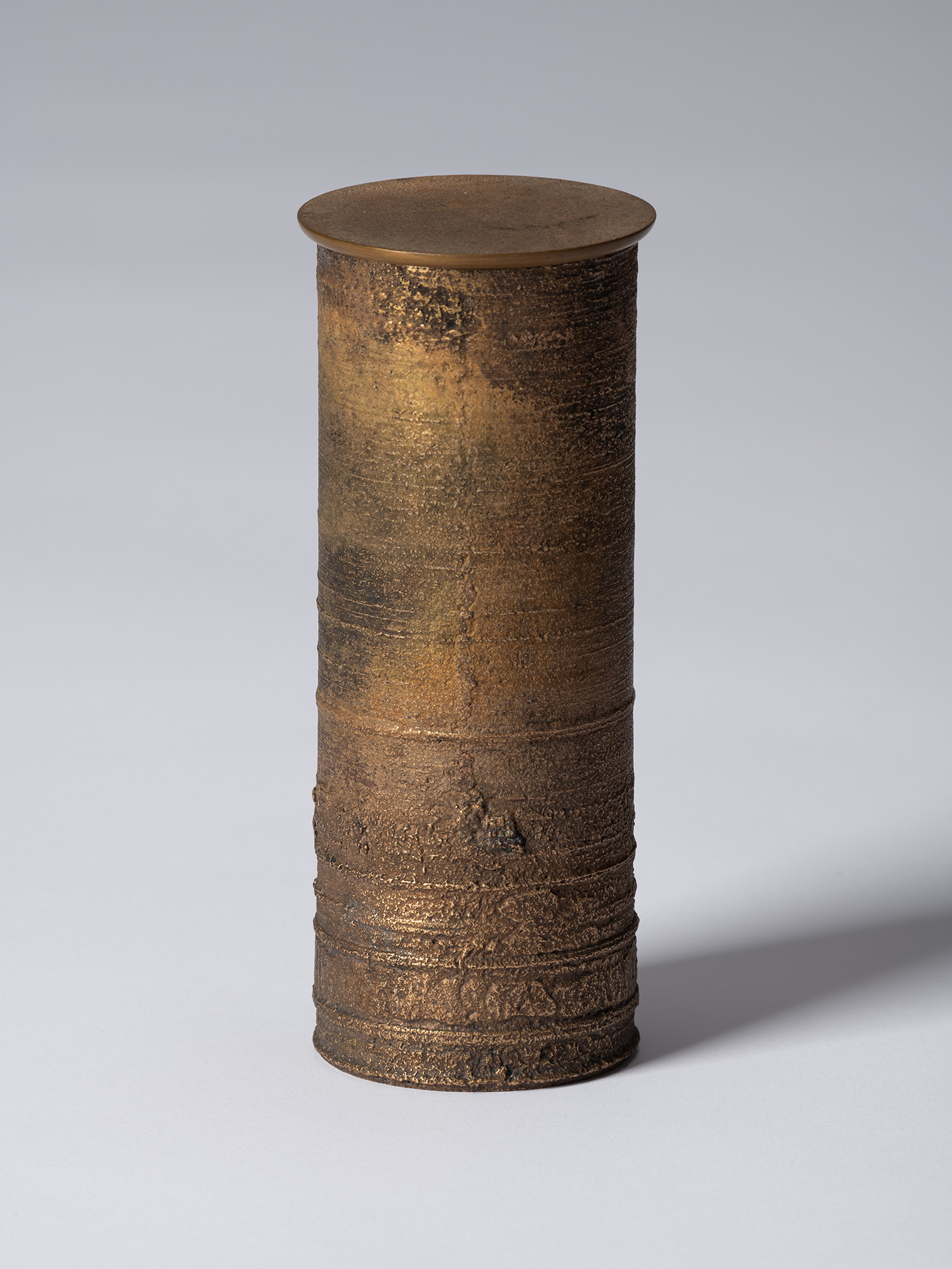 ronze as Bronze II No. 18 by Koji Hatakeyama, a tall cylindrical bronze vessel with a fitted circular...