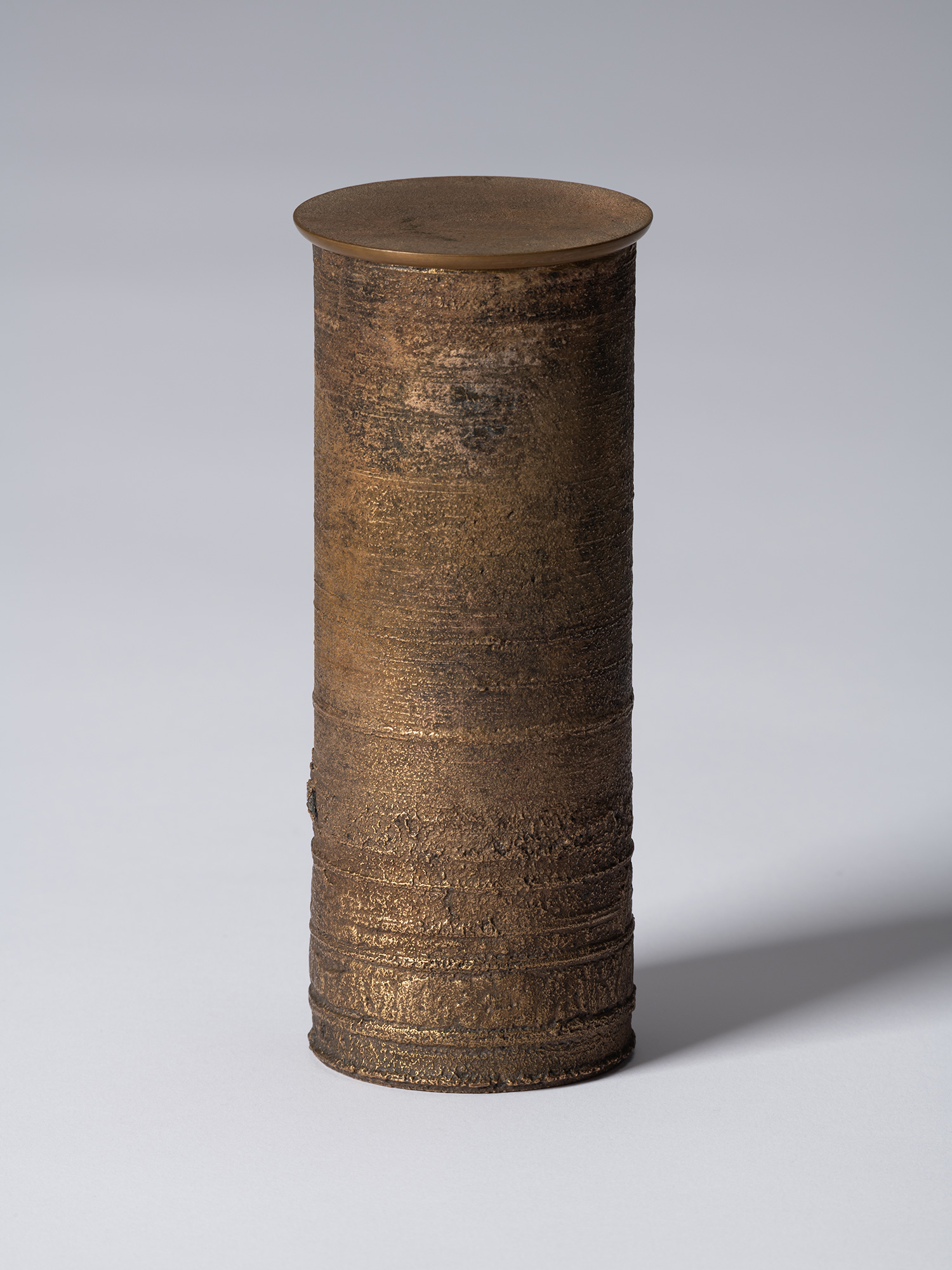 ronze as Bronze II No. 18 by Koji Hatakeyama, a tall cylindrical bronze vessel with a fitted circular...