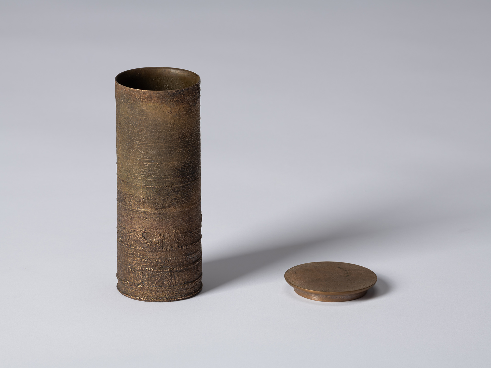 bronze as Bronze II No. 18 by Koji Hatakeyama shown with its circular lid removed, revealing the...