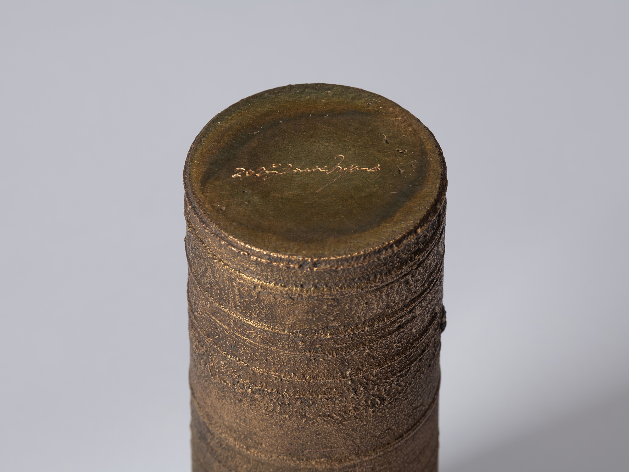 Detail of the base of Koji Hatakeyama’s bronze as Bronze II No. 18, showing the artist’s signature...
