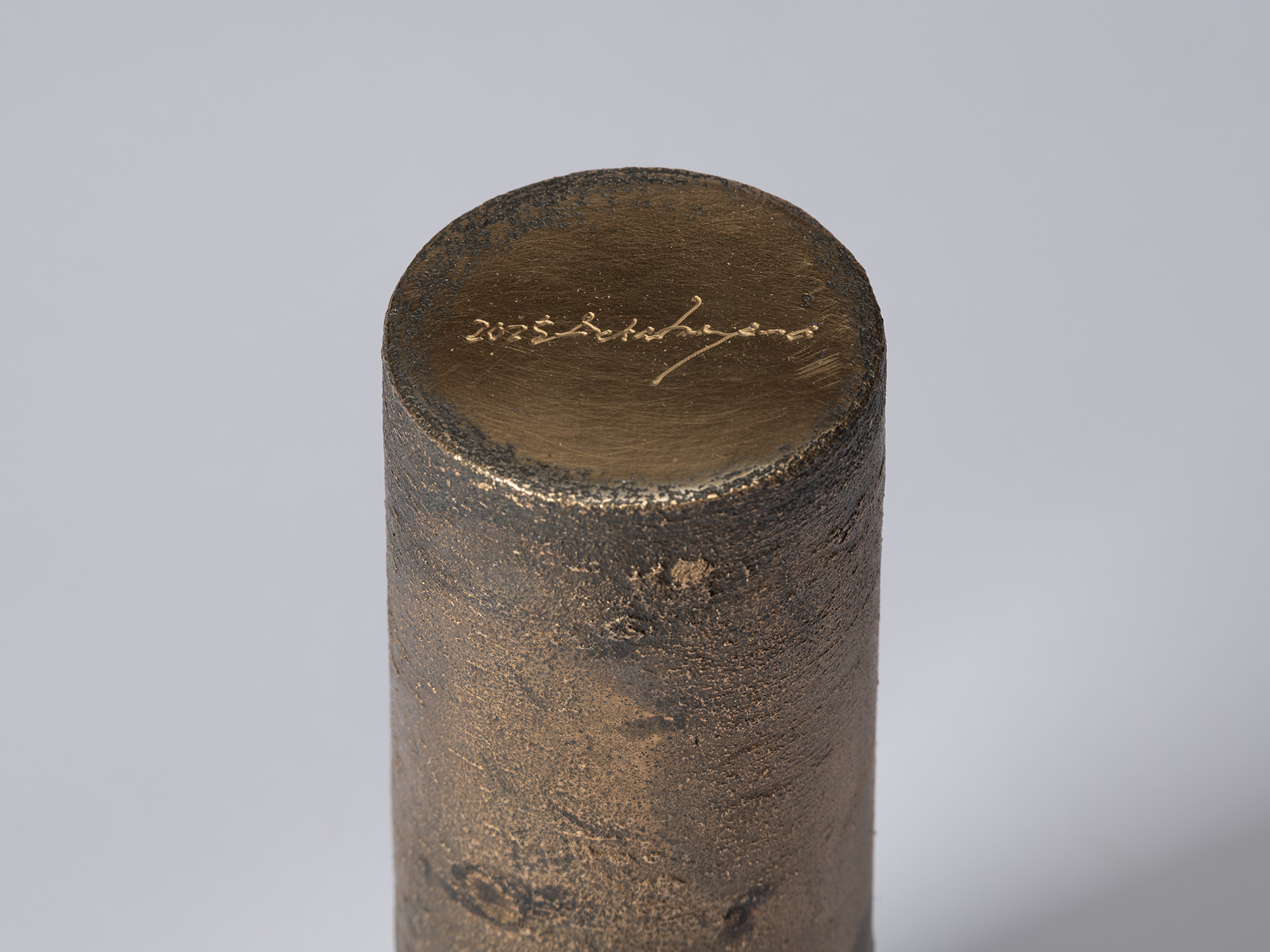 Detail of the base of bronze as Bronze II No. 19 by Koji Hatakeyama, showing the artist’s incised...