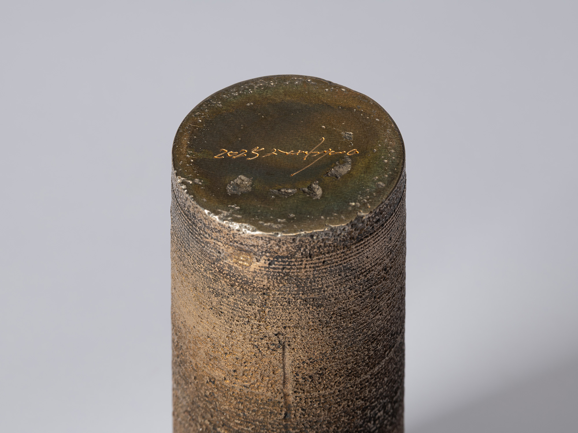 Detail of the base of bronze as Bronze II No. 20 by Koji Hatakeyama, showing the artist’s incised...