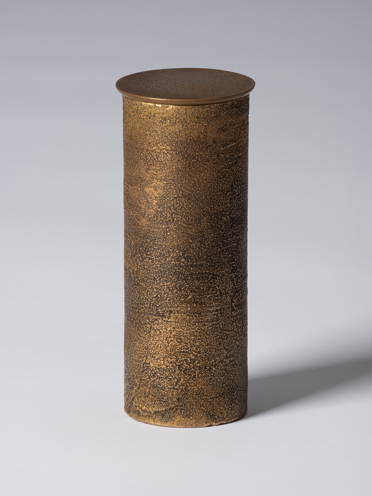 View of bronze as Bronze II No. 21 by Koji Hatakeyama, a tall cylindrical bronze vessel with a...