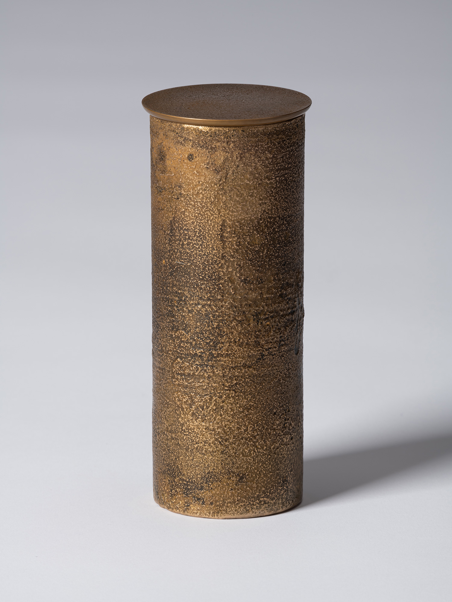 View of bronze as Bronze II No. 21 by Koji Hatakeyama, a tall cylindrical bronze vessel with a...