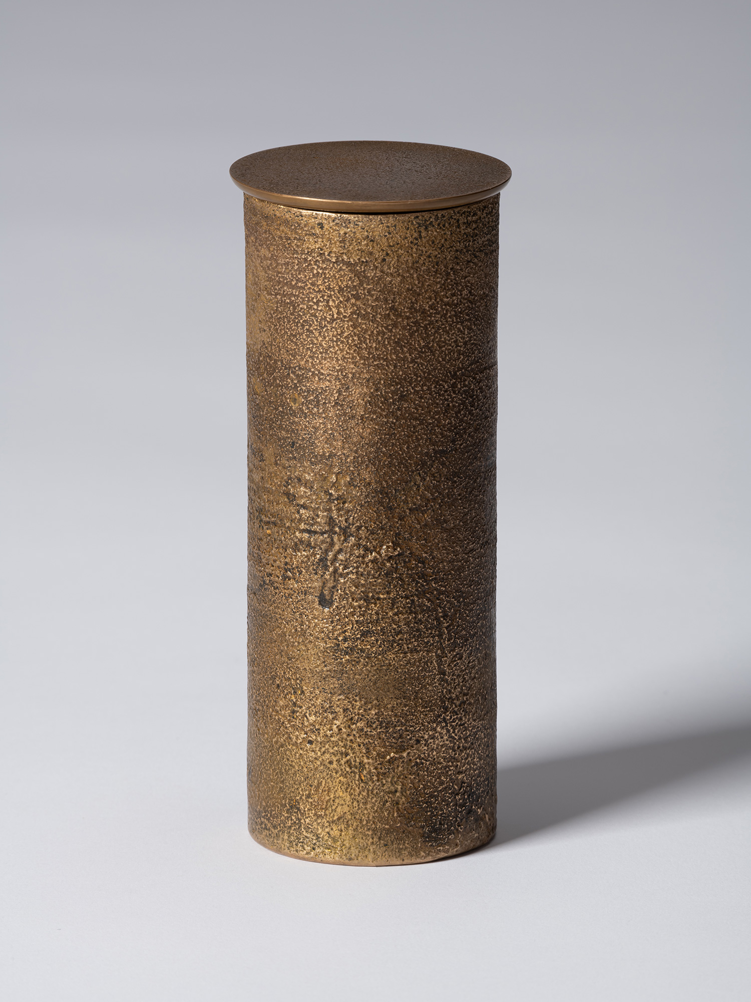 View of bronze as Bronze II No. 21 by Koji Hatakeyama, a tall cylindrical bronze vessel with a...