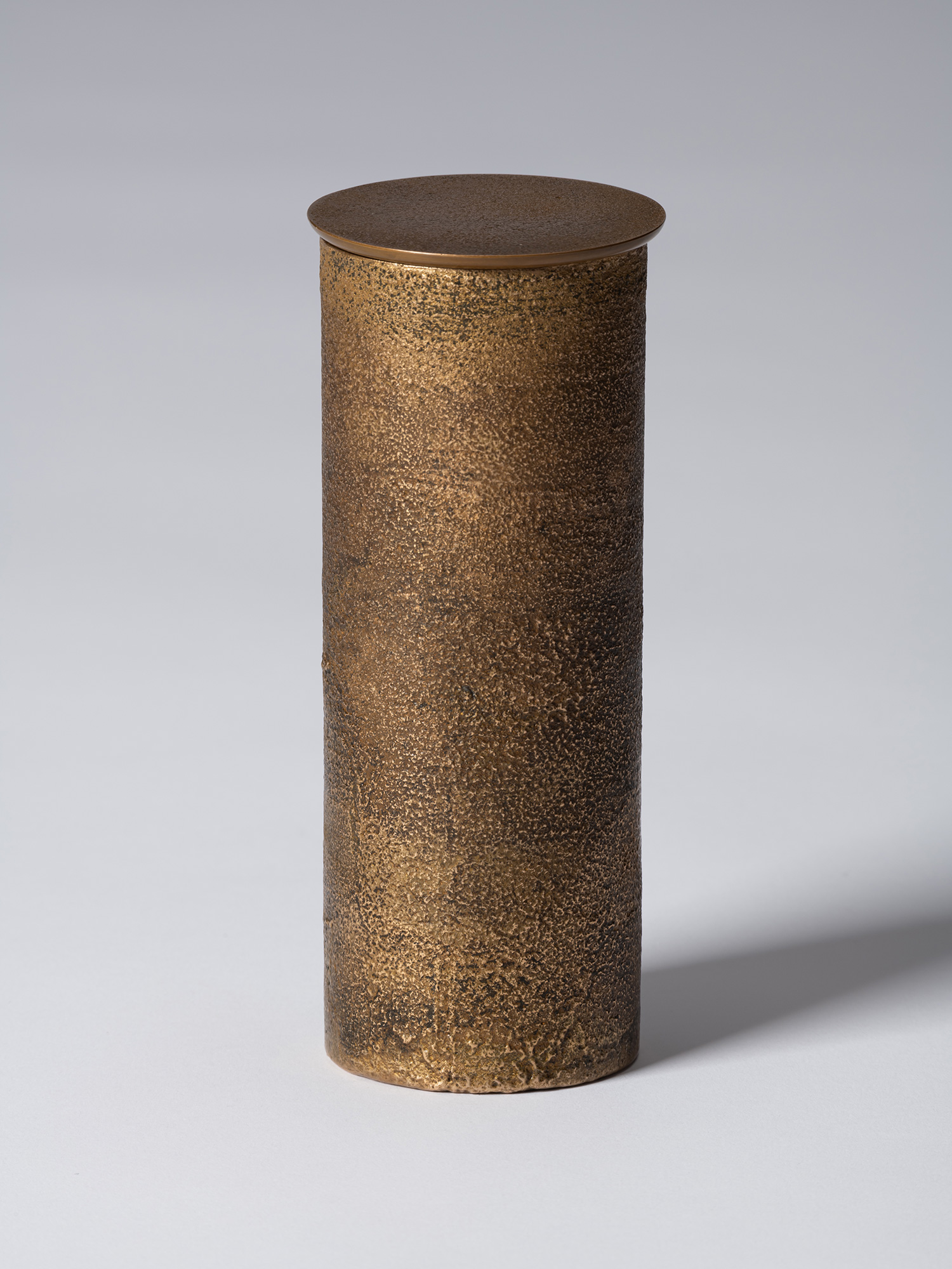 View of bronze as Bronze II No. 21 by Koji Hatakeyama, a tall cylindrical bronze vessel with a...