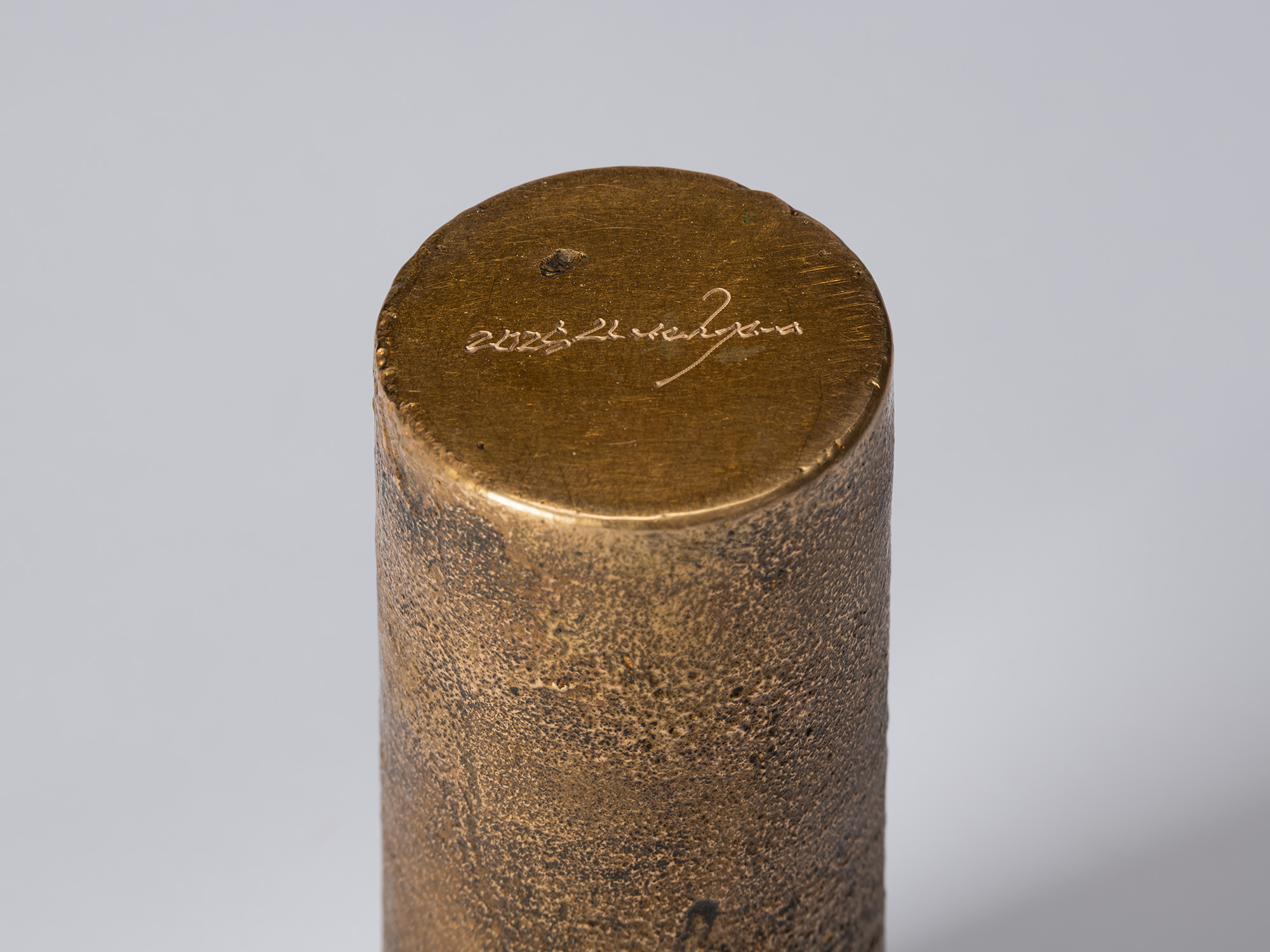Detail of the base of bronze as Bronze II No. 21 by Koji Hatakeyama, showing the artist’s incised...