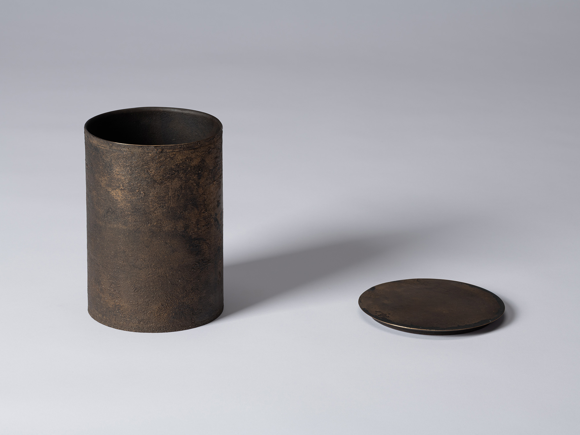 Koji Hatakeyama’s bronze as Bronze II No. 22 shown with its circular lid removed, revealing the...