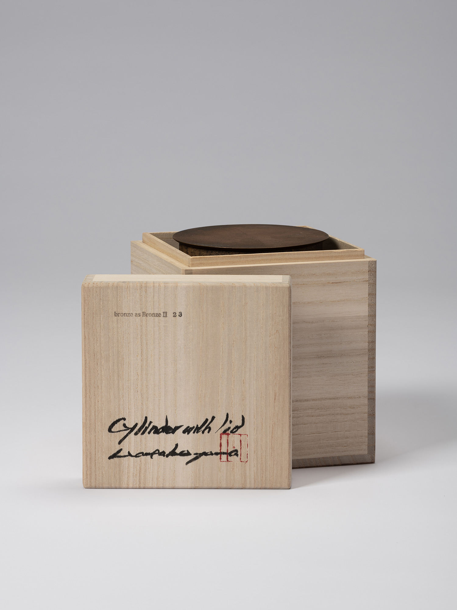 Open wooden tomobako for Koji Hatakeyama’s bronze as Bronze II No. 23, with the inscribed lid resting...