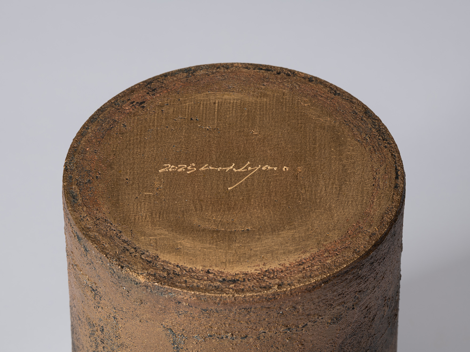 Detail of the underside of Koji Hatakeyama’s bronze as Bronze II No. 23, showing a smoother circular...