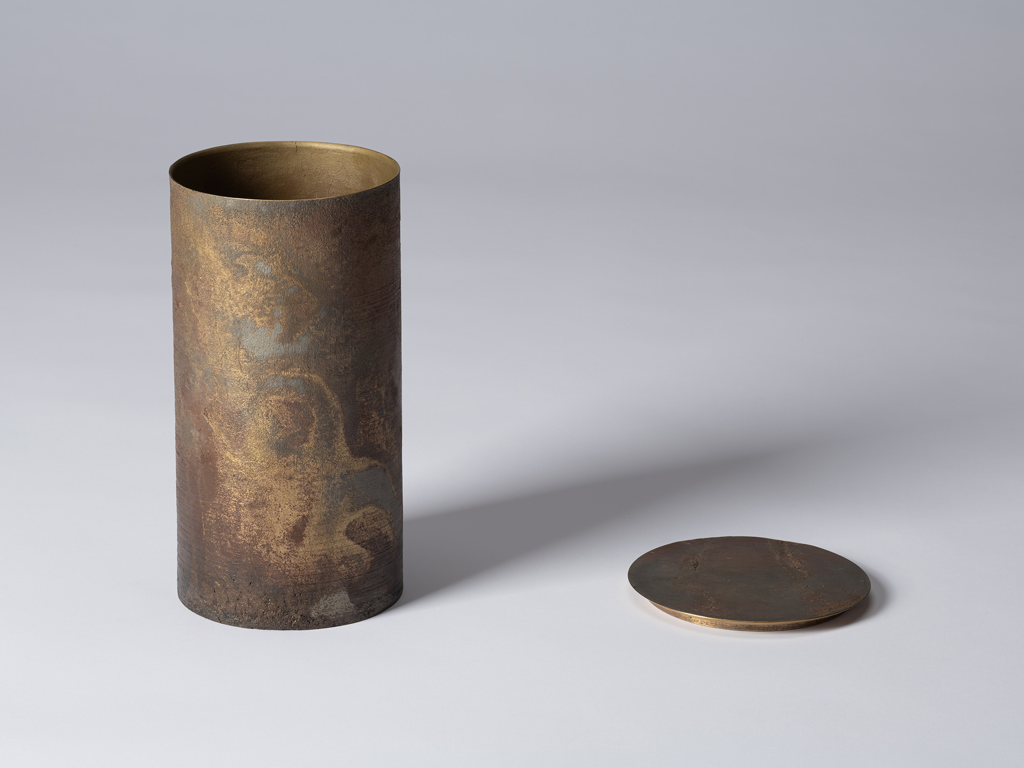 Koji Hatakeyama’s bronze as Bronze II No. 24 shown with its circular lid removed, revealing the...