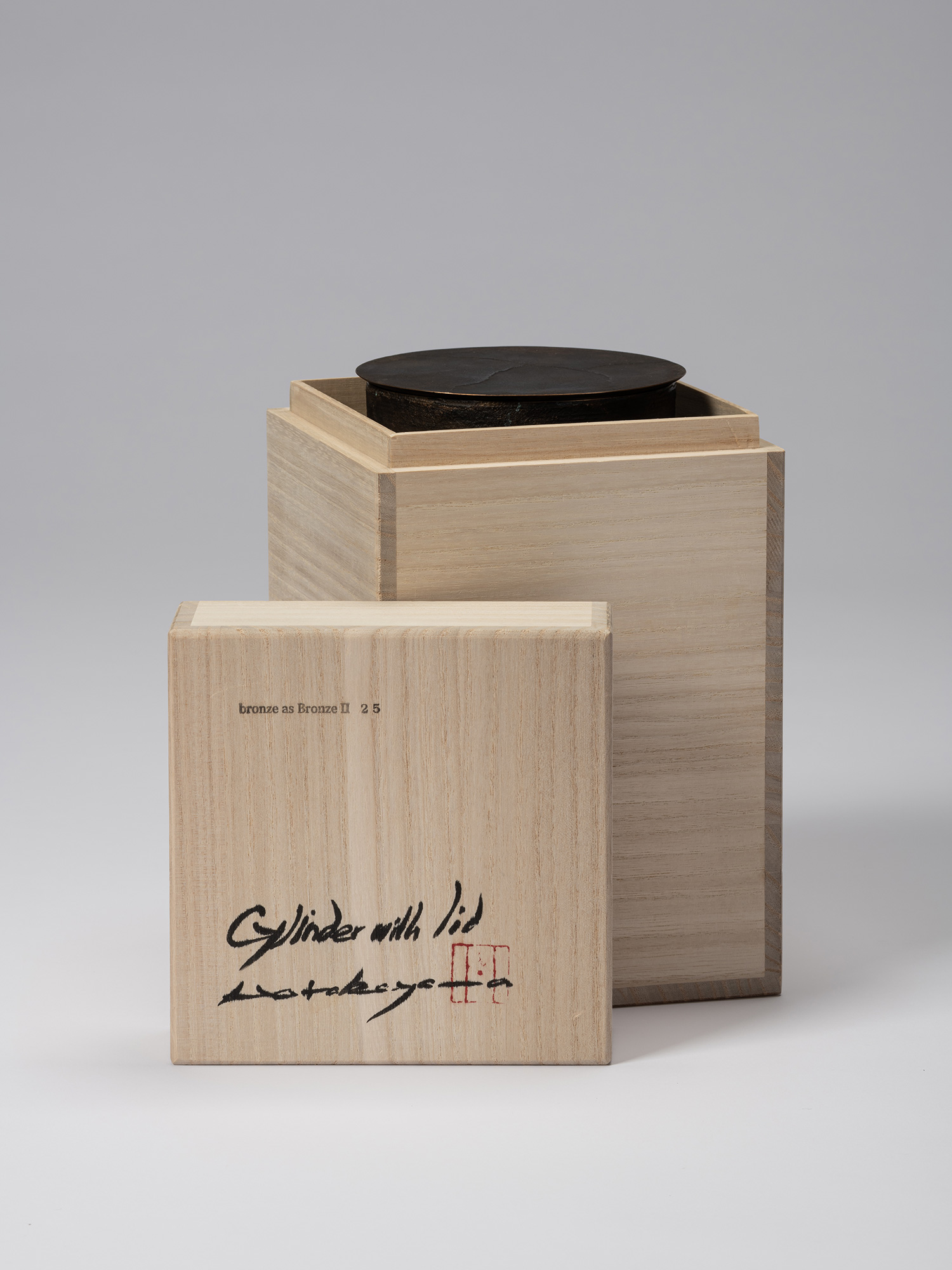 Open wooden tomobako for Koji Hatakeyama’s bronze as Bronze II No. 25, with the inscribed lid resting...