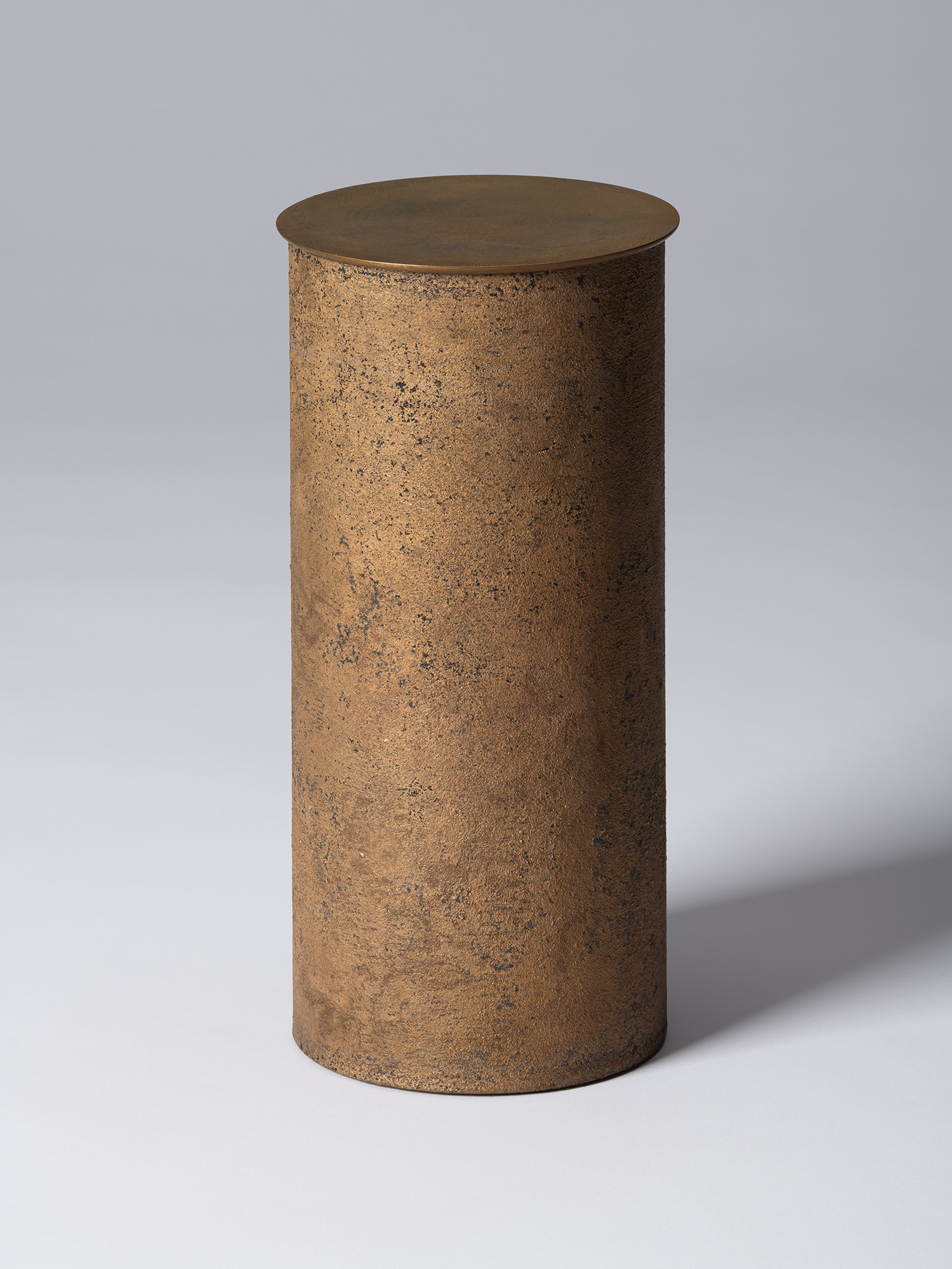 View of Koji Hatakeyama’s bronze as Bronze II No. 26, a tall cylindrical bronze vessel with a flat...