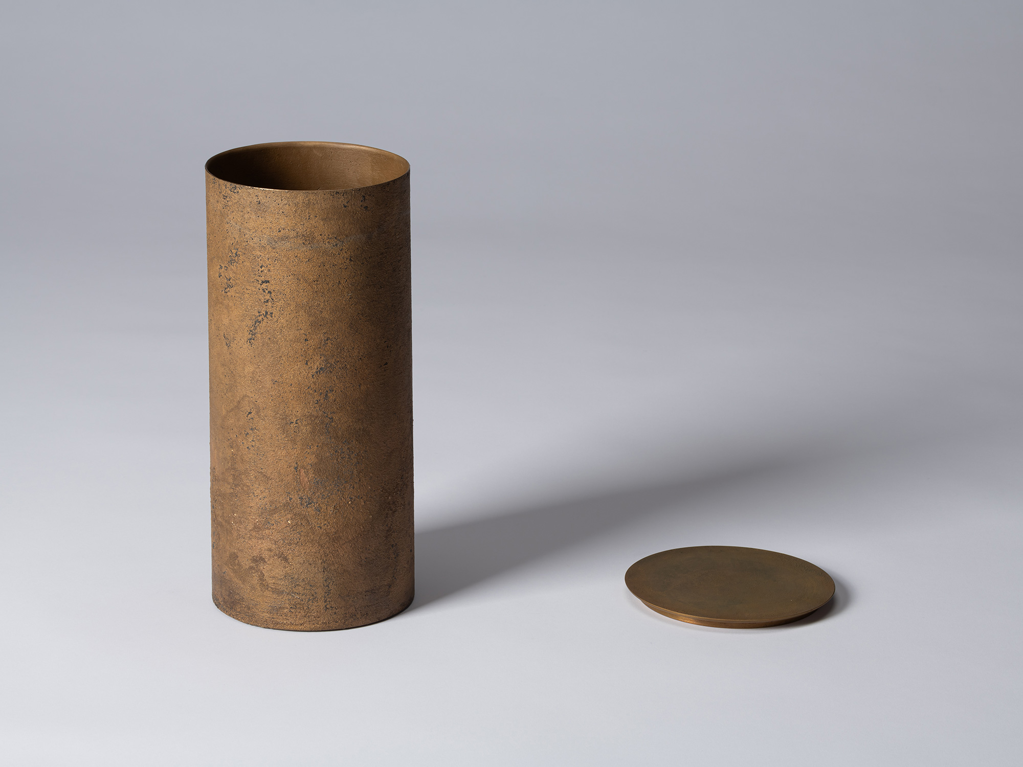 Koji Hatakeyama’s bronze as Bronze II No. 26 shown with its circular lid removed, revealing the...
