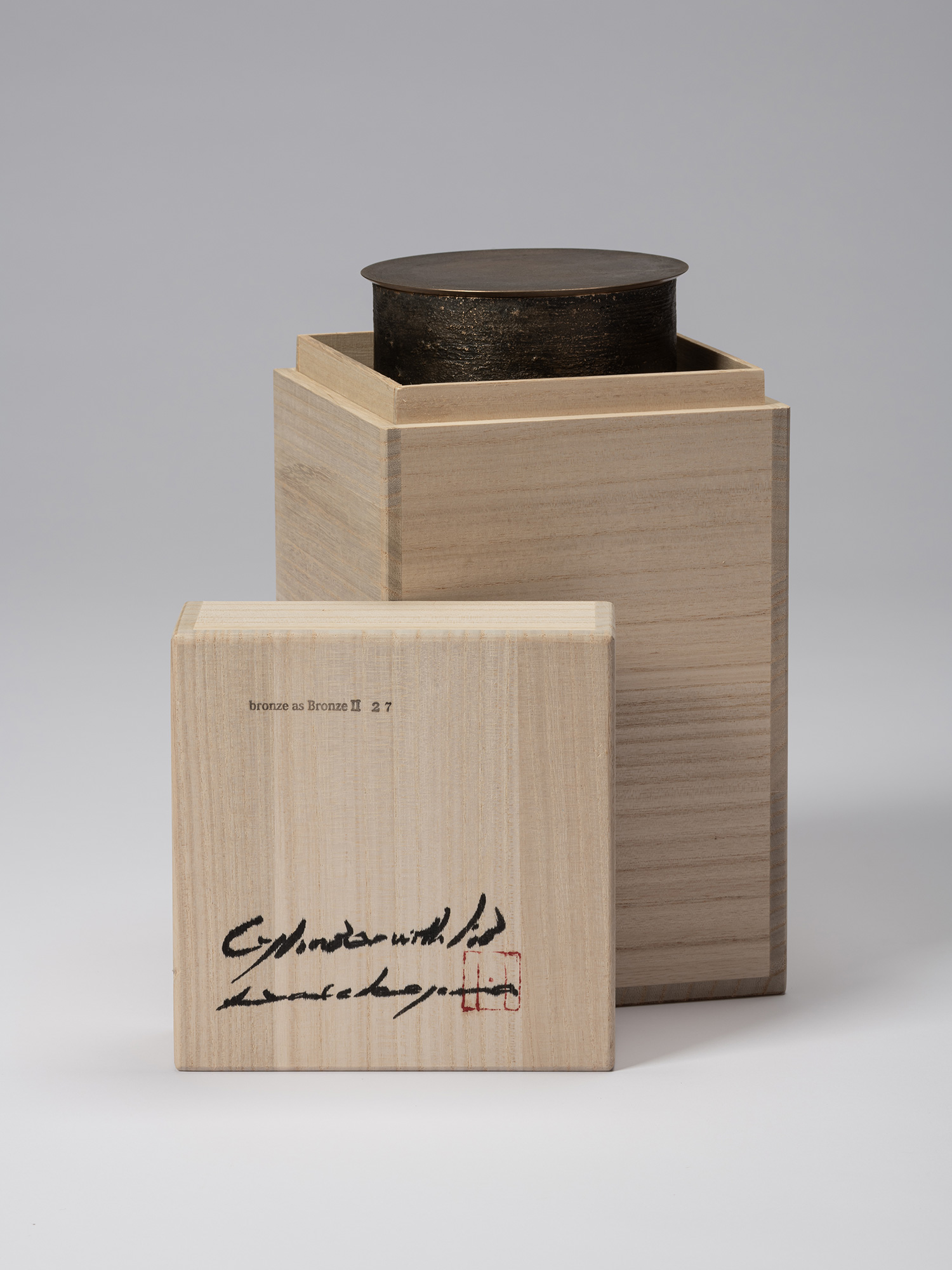 Bronze as Bronze II No. 27 partially enclosed in its open tomobako, with the inscribed wooden lid...