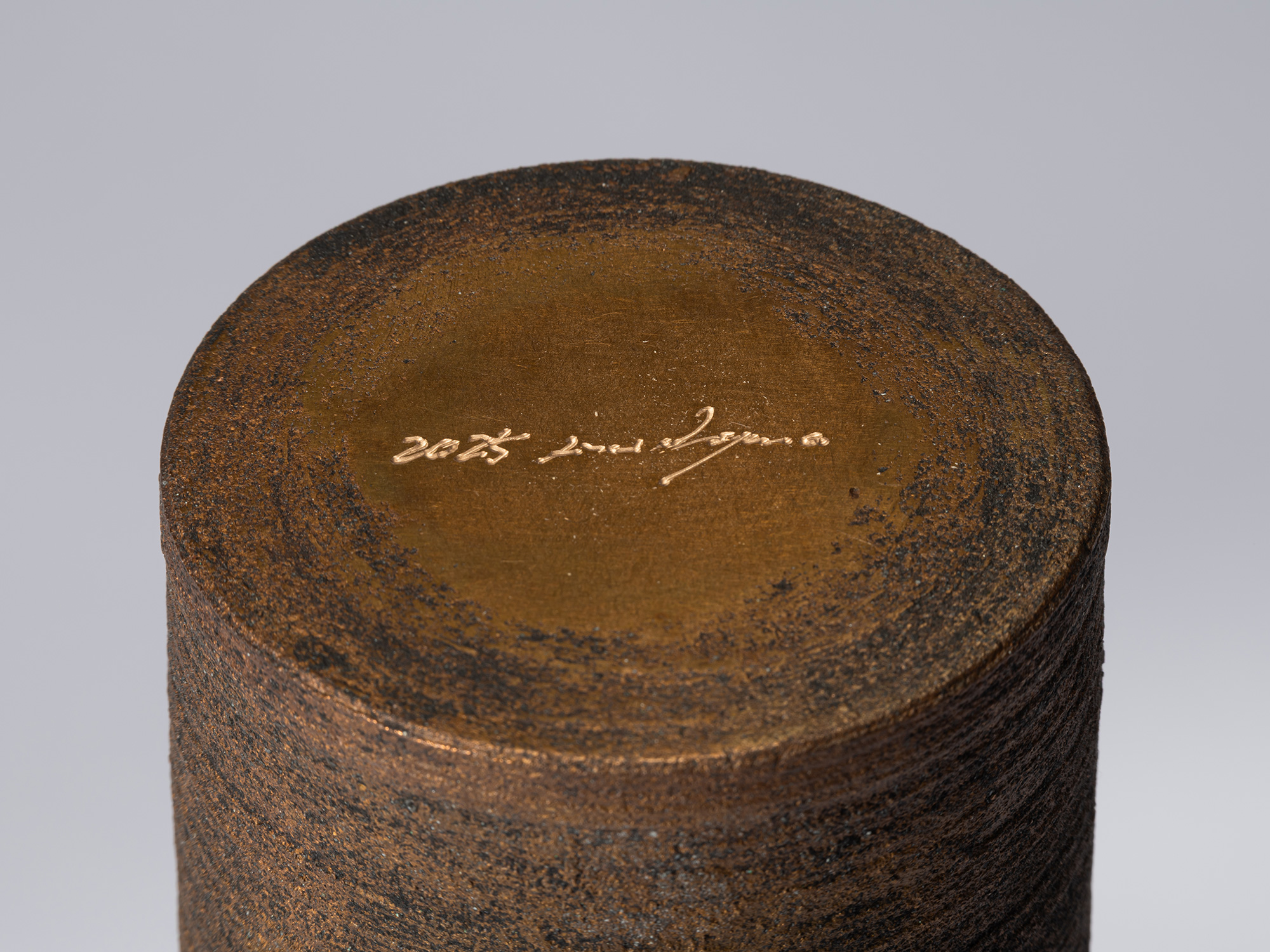 Close-up of the underside of Bronze as Bronze II No. 27, showing the textured bronze surface surrounding...