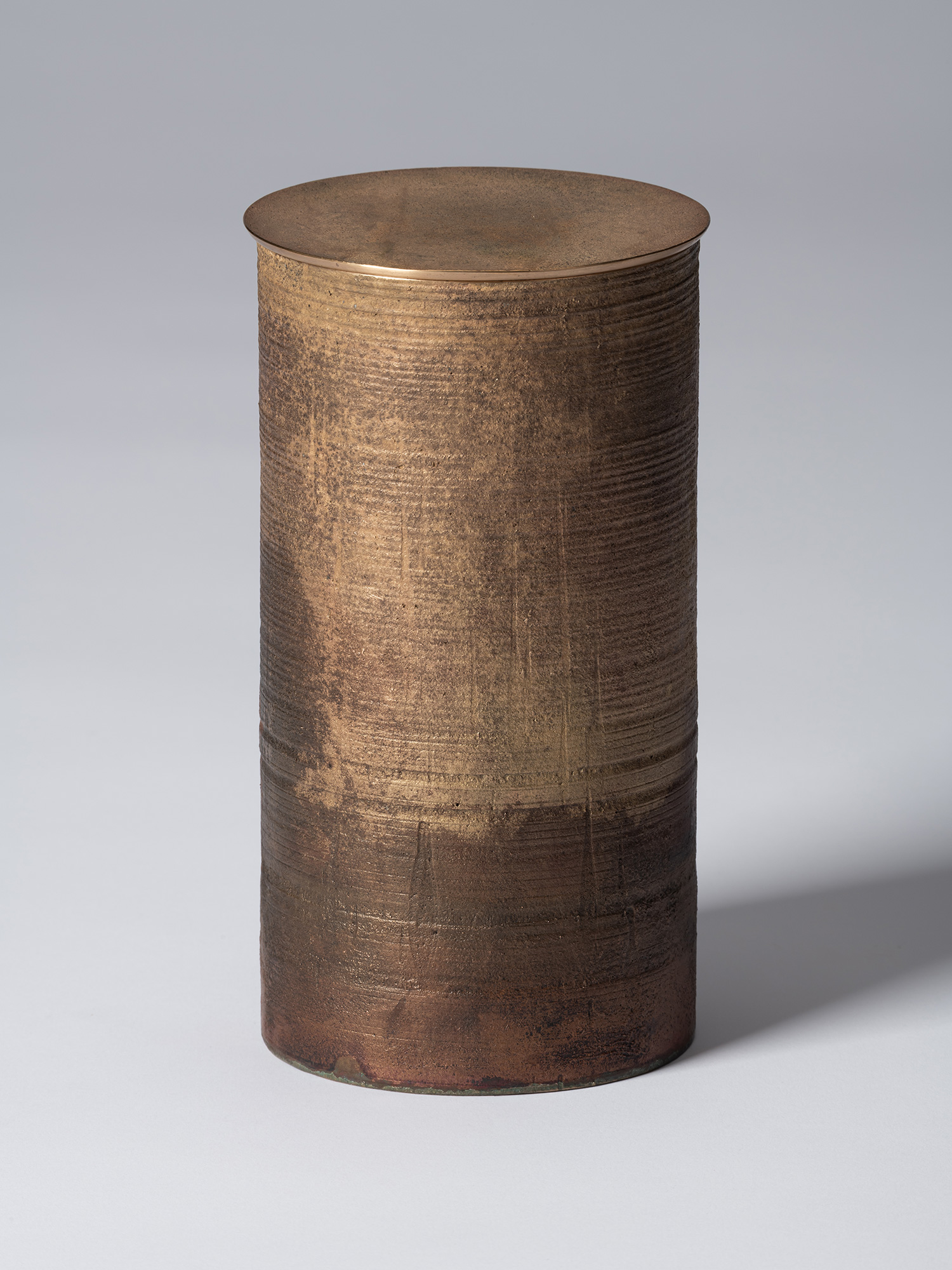 View of Koji Hatakeyama’s bronze as Bronze II No. 29, a tall cylindrical bronze vessel with a flat,...