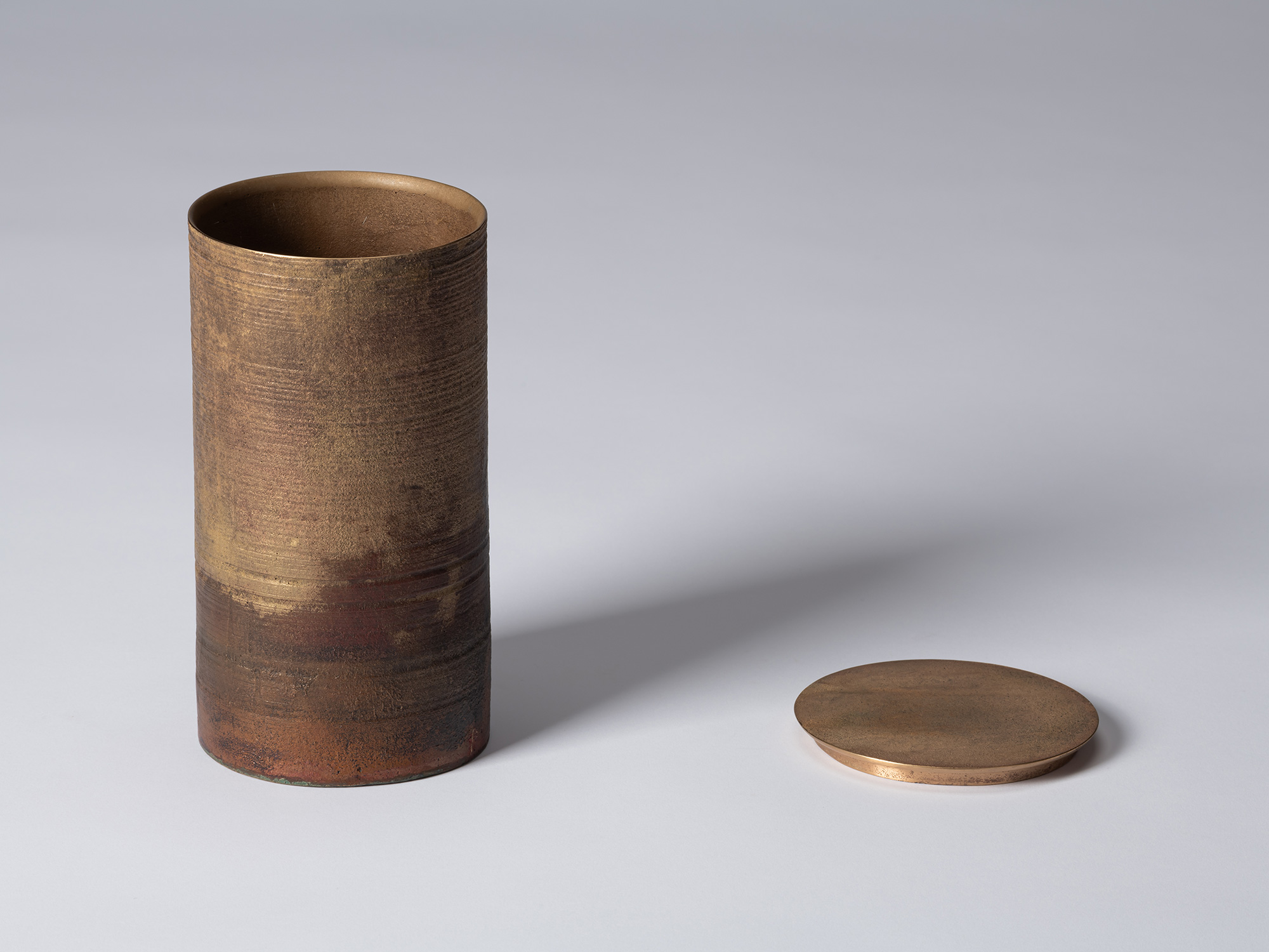 Koji Hatakeyama’s bronze as Bronze II No. 29 with its disc-shaped lid removed and placed beside...