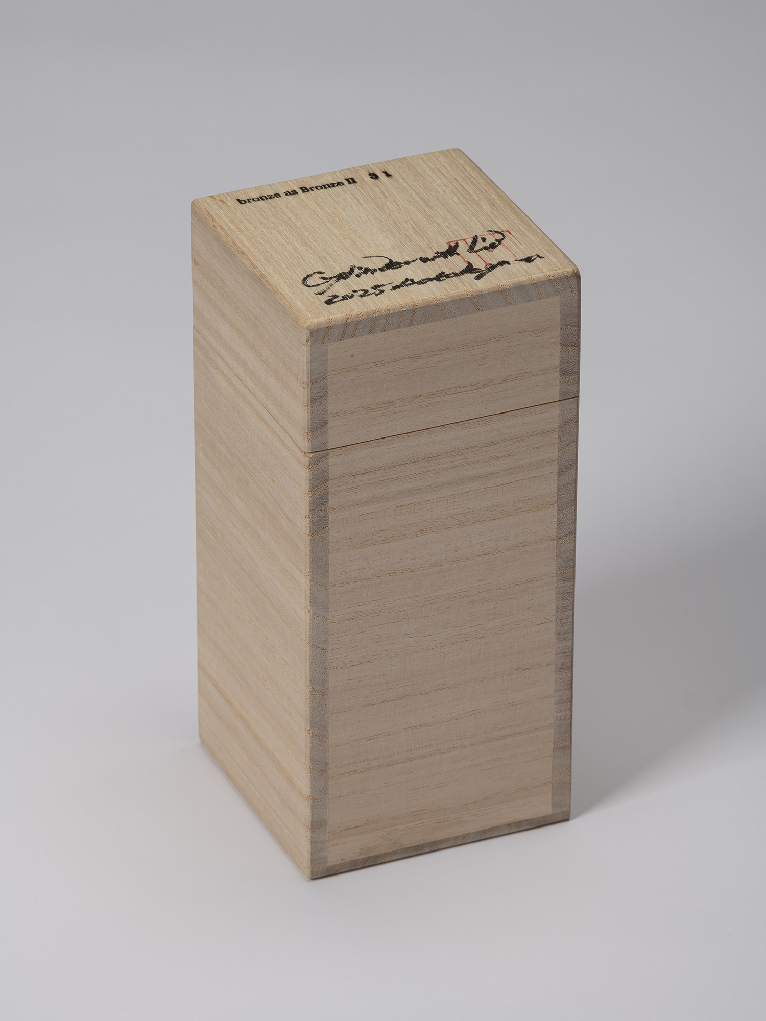 Closed wooden tomobako for bronze as Bronze II No. 31 by Koji Hatakeyama, with the title, artist’s...