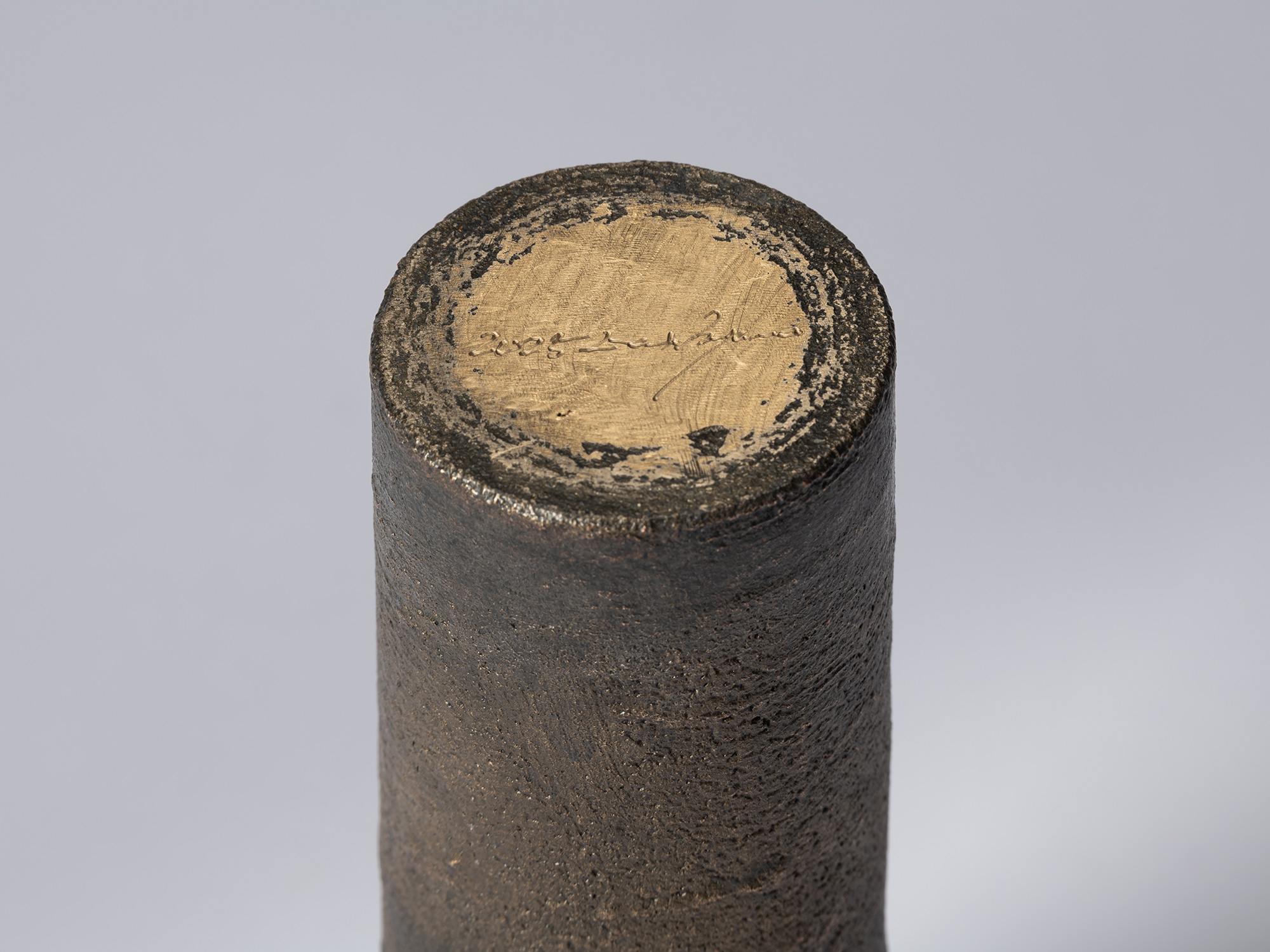 Detail of the base of bronze as Bronze II No. 31 by Koji Hatakeyama, showing the artist’s incised...