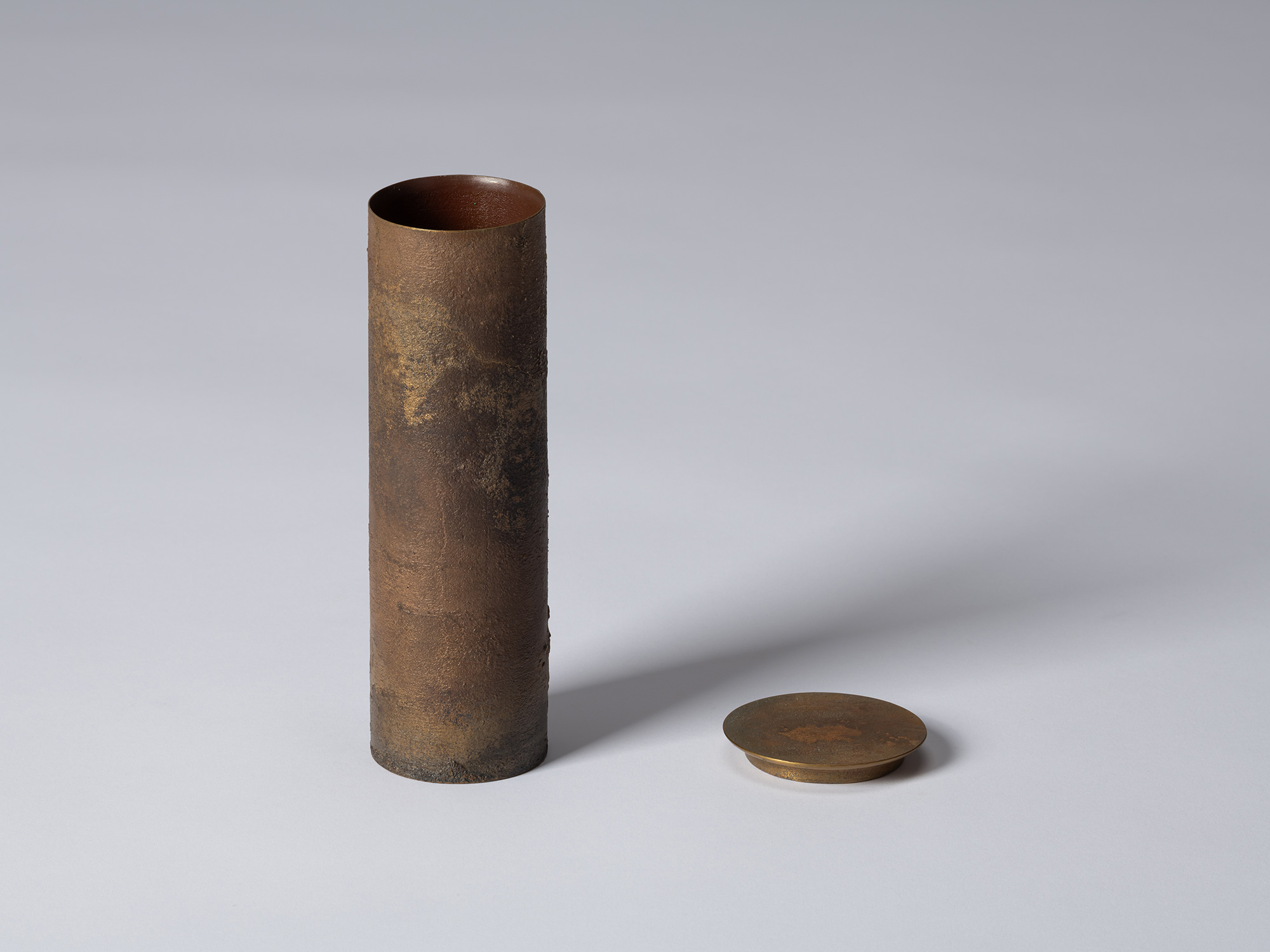 Koji Hatakeyama’s bronze as Bronze II No. 33 shown with its disc-shaped lid removed and placed...