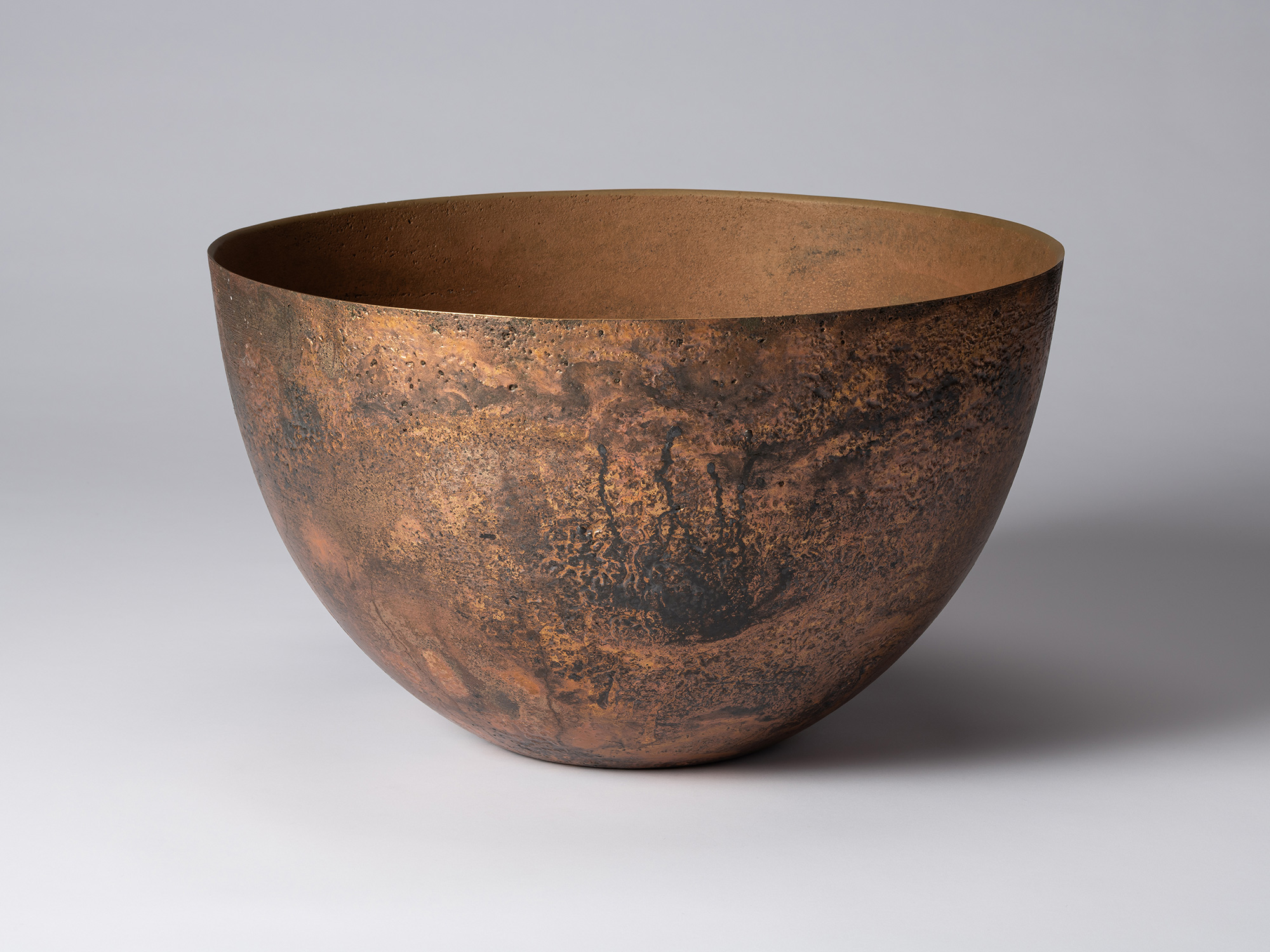 Front view of Koji Hatakeyama’s bronze as Bronze II No. 6, a wide, rounded bronze vessel with gently...