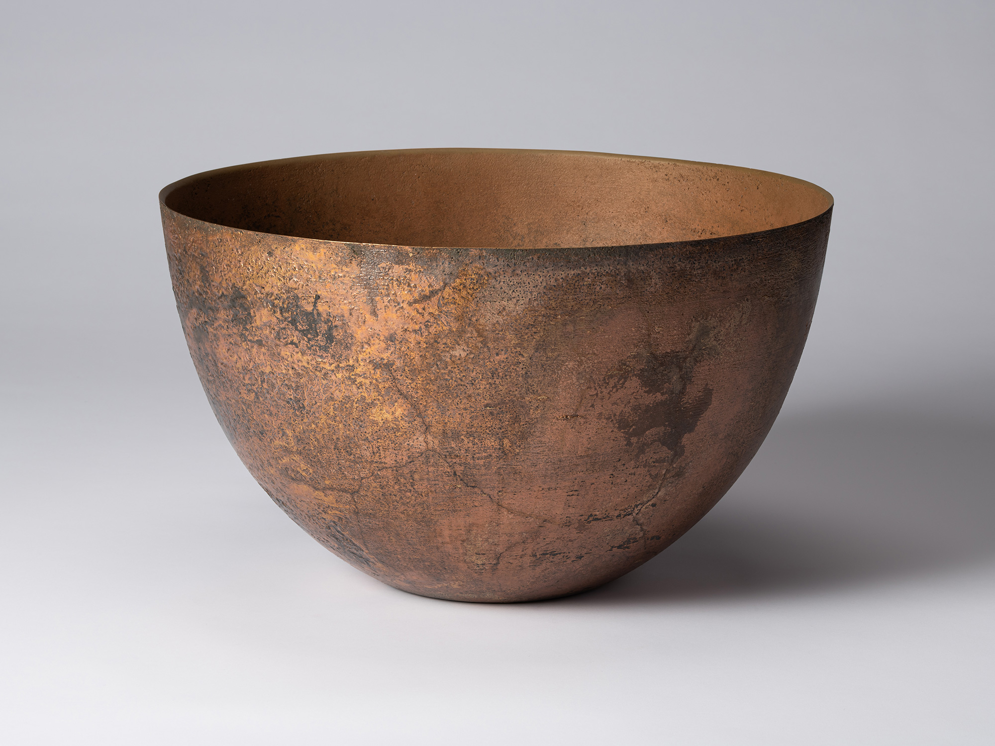 Front view of Koji Hatakeyama’s bronze as Bronze II No. 6, a wide, rounded bronze vessel with gently...