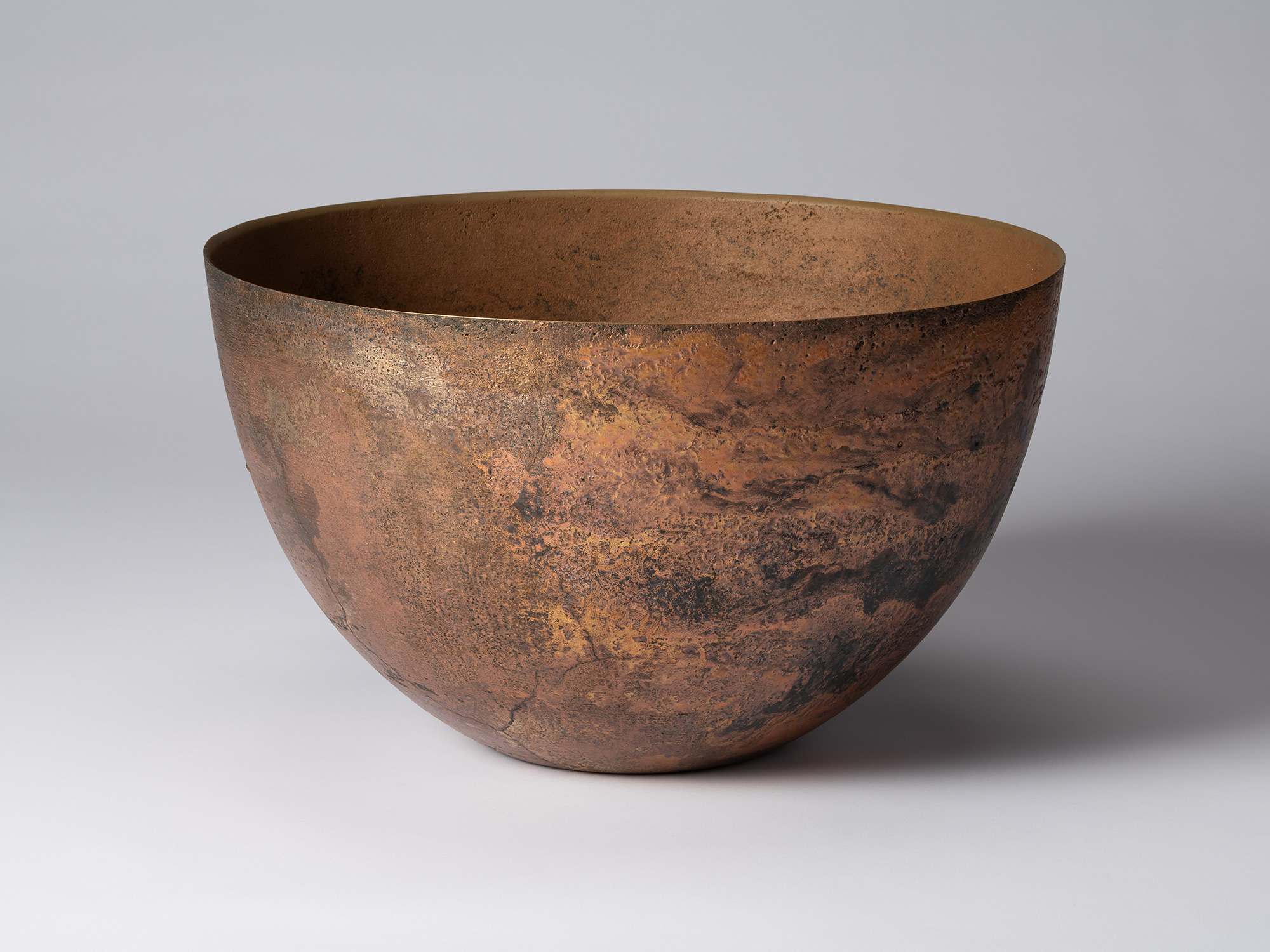 Front view of Koji Hatakeyama’s bronze as Bronze II No. 6, a wide, rounded bronze vessel with gently...