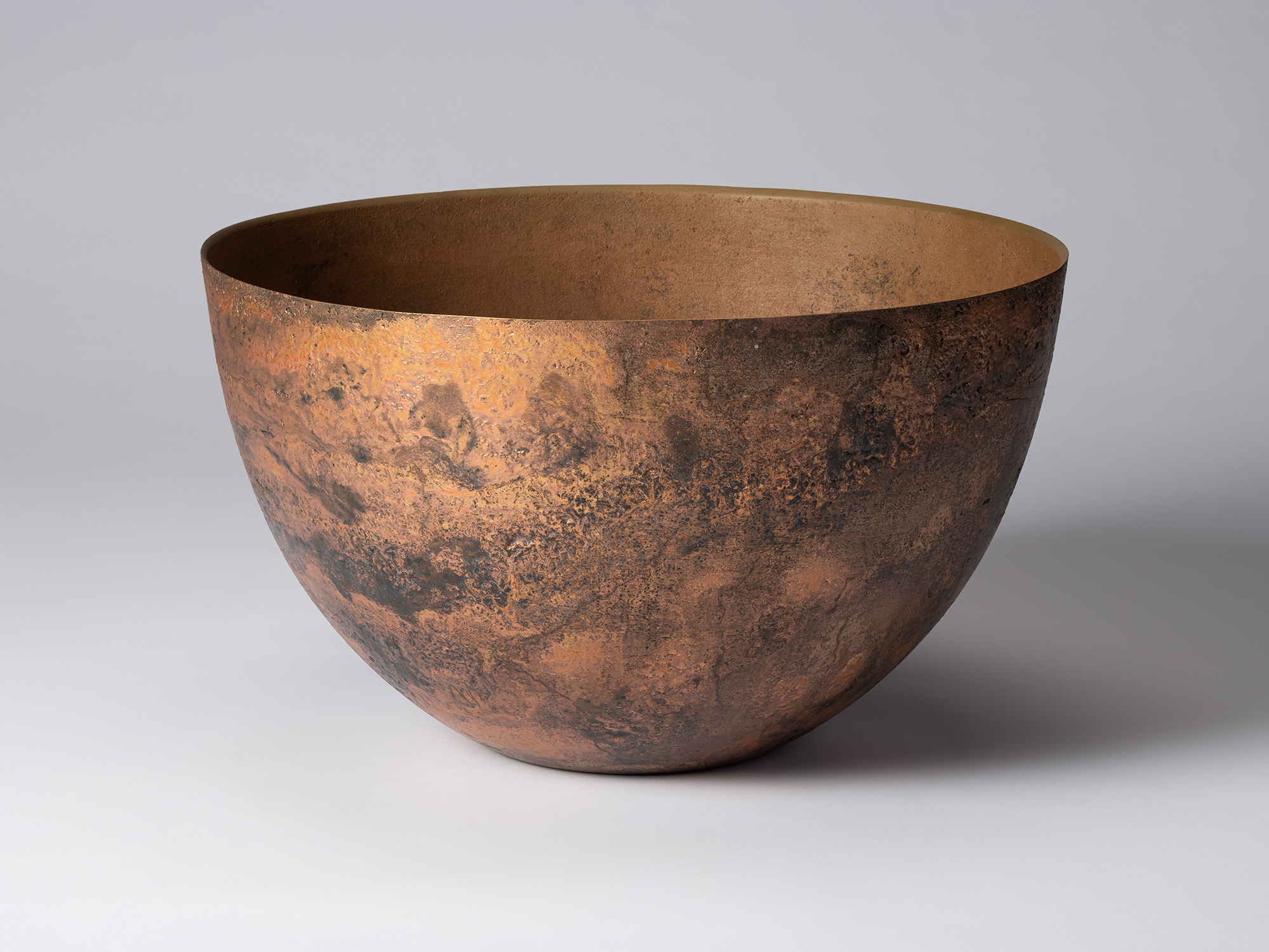 Front view of Koji Hatakeyama’s bronze as Bronze II No. 6, a wide, rounded bronze vessel with gently...
