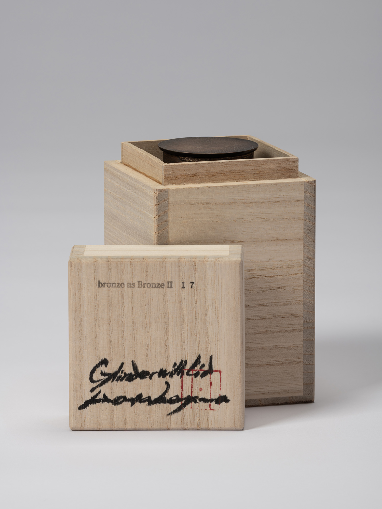 Koji Hatakeyama’s bronze as Bronze II No. 17 partially enclosed in its wooden tomobako, with the...
