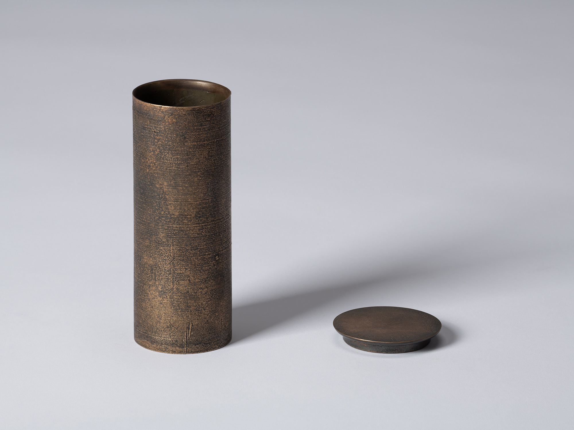 bronze as Bronze II No. 17 by Koji Hatakeyama shown with its circular lid removed, revealing the...